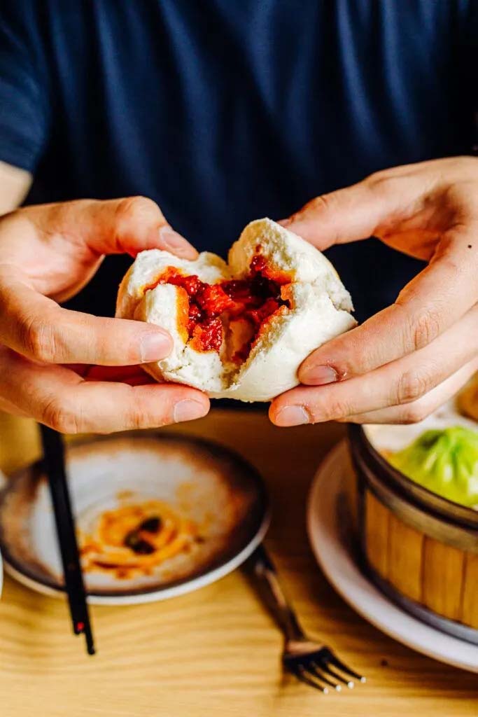 Steamed buns come with a variety of fillings made of braised beef, steamed pork and braised pork belly, pictured here.<br />(Joshua Foo / Flatwater Free Press)