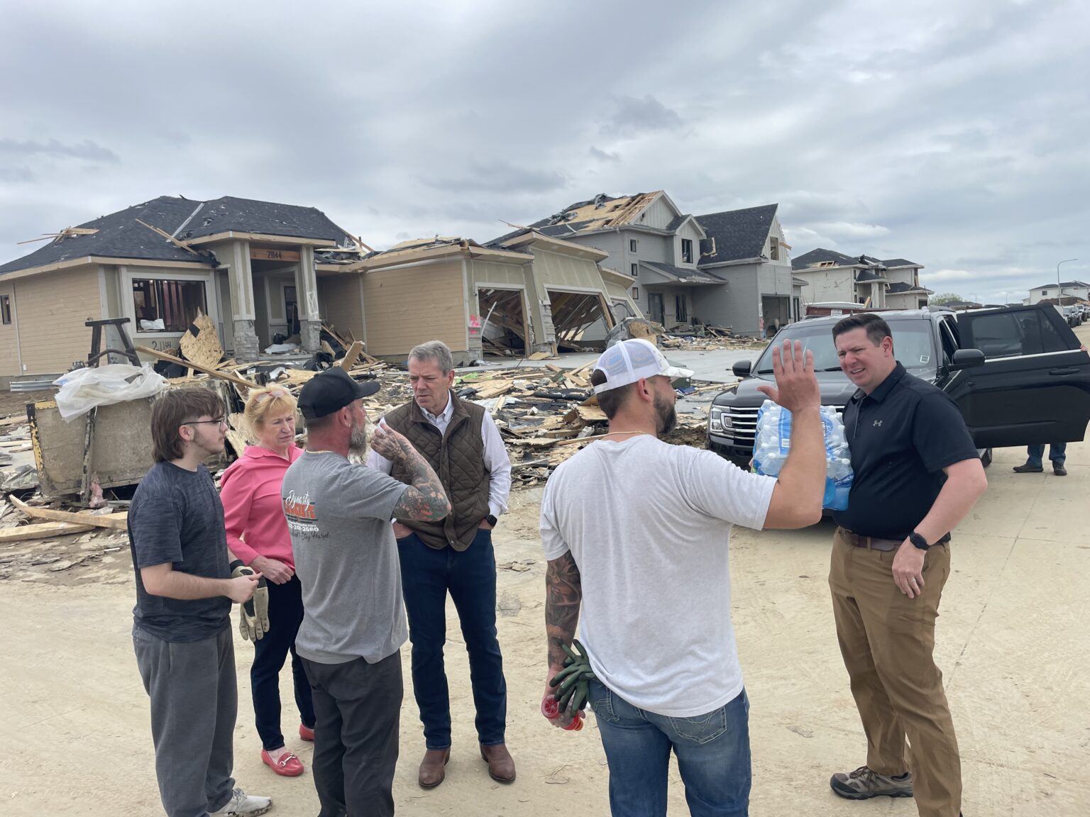Nebraska Gov. Jim Pillen (center) joins then-State Sen. Lou Ann Linehan of Omaha in her Elkhorn-area district, visiting people in Douglas County who had homes damaged by the tornadoes that hit the area April 26, 2024.<br />(Courtesy of the Governor’s Office)