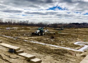 Construction crews prepare an Elkhorn area site for the mixed-income Capriana neighborhood. (Cindy Gonzalez / Nebraska Examiner)