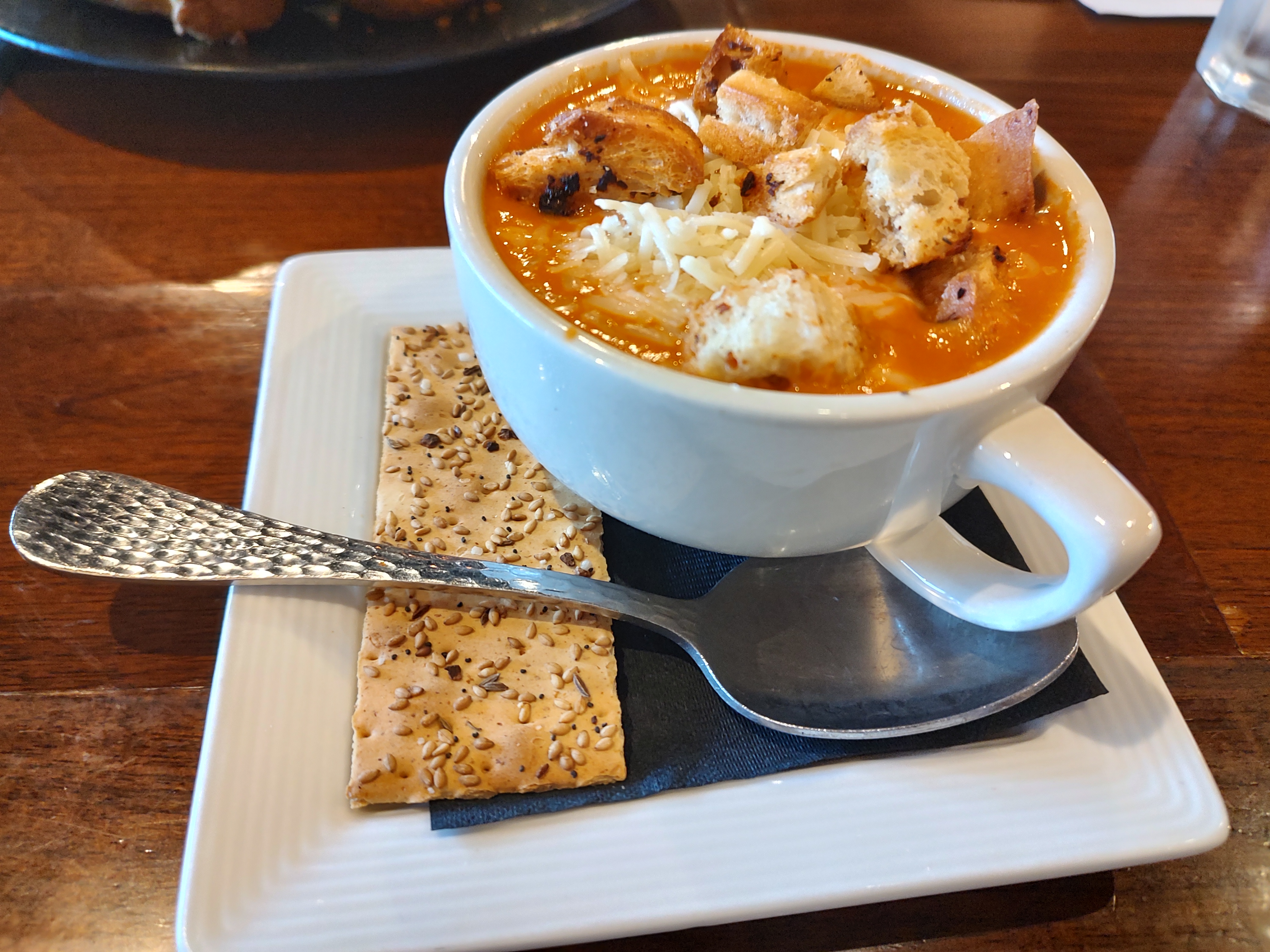 The stupendous Tomato-Red Pepper Bisque (the spoon is giant. This is a sizeable bowl of soup!)<br />(Austin Petak / The Daily Record)