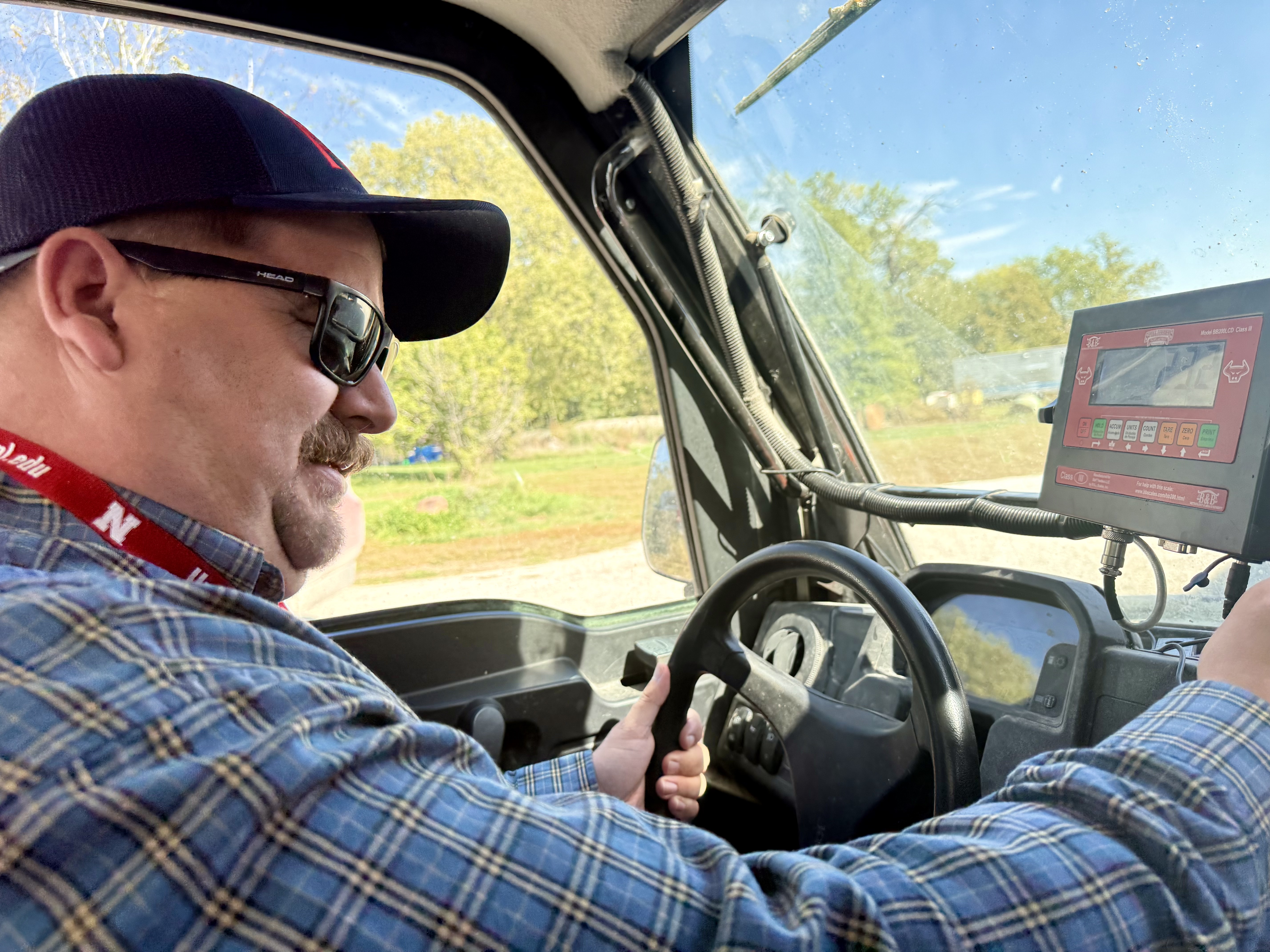 Eric Fass is able the work in limited capacity on his farm with the help of special equipment.<br />(Cindy Gonzalez / Nebraska Examiner)