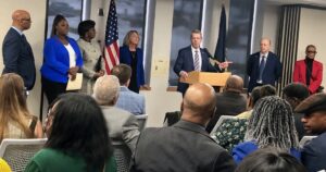 Gov. Jim Pillen, flanked by Mayor Jean Stothert and Department of Economic Development Director K.C. Belitz, attend an event in North Omaha to announce award winners.<br />(Cindy Gonzalez / Nebraska Examiner)