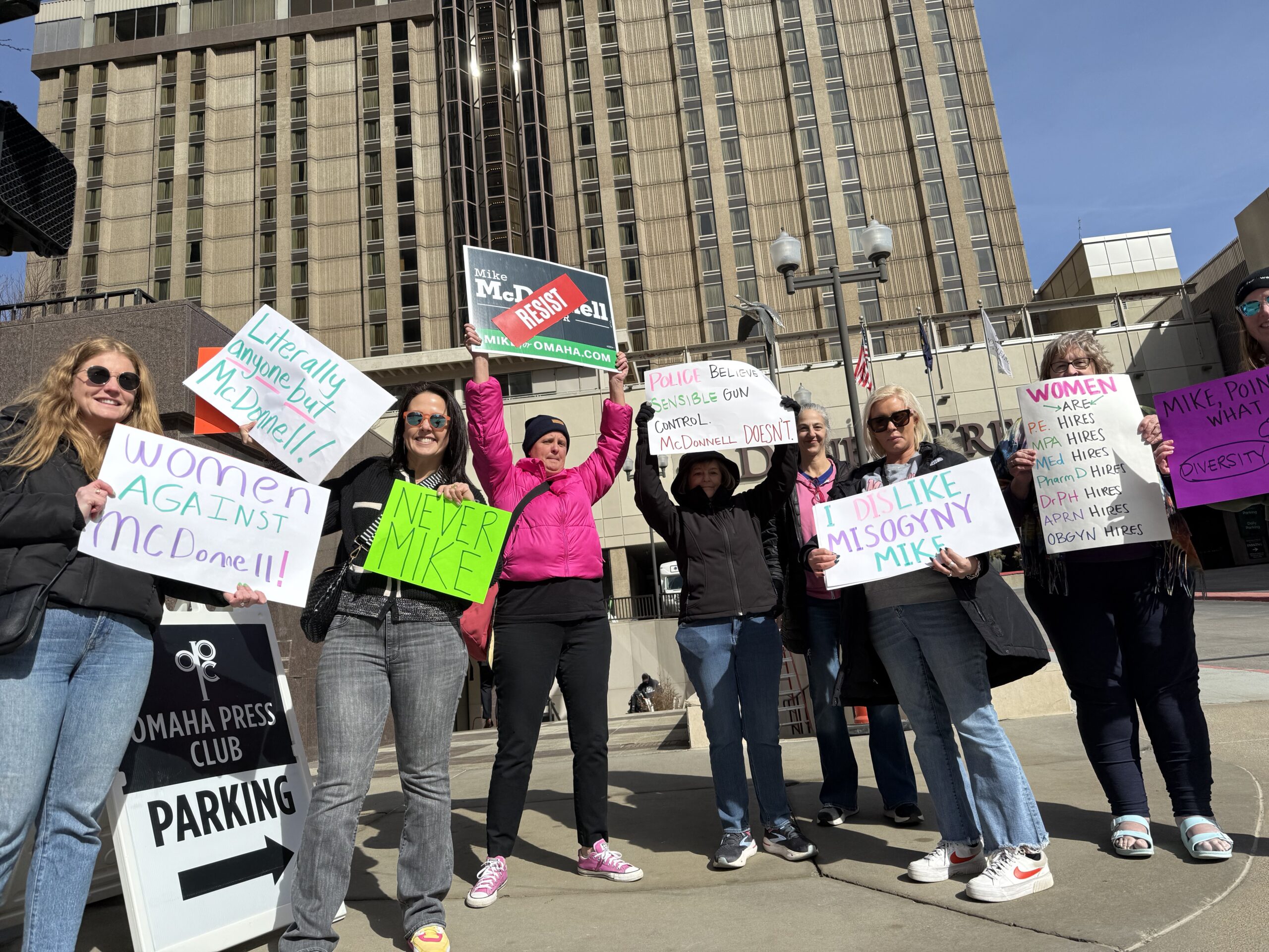 A handful of protesters, including some Democrats from Douglas County, protest Republican State Sen. Mike McDonnell’s bid for Omaha mayor outside of the Omaha Press Club debate.<br />(Aaron Sanderford / Nebraska Examiner)