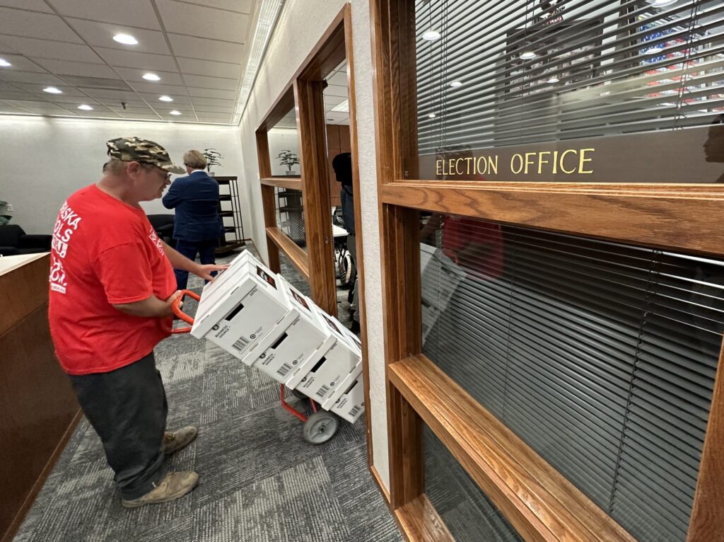 Volunteers bring boxes into the Secretary of State’s Office for Support Our Schools.<br />(Aaron Sanderford / Nebraska Examiner)