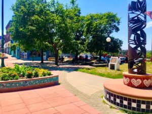 The entrance to La Plaza de la Raza along the historic South 24th Street corridor at N Streets. The parking lot in the background would see a major renovation with a recommended grant from the state Economic Recovery Act. (Cindy Gonzalez / Nebraska Examiner)
