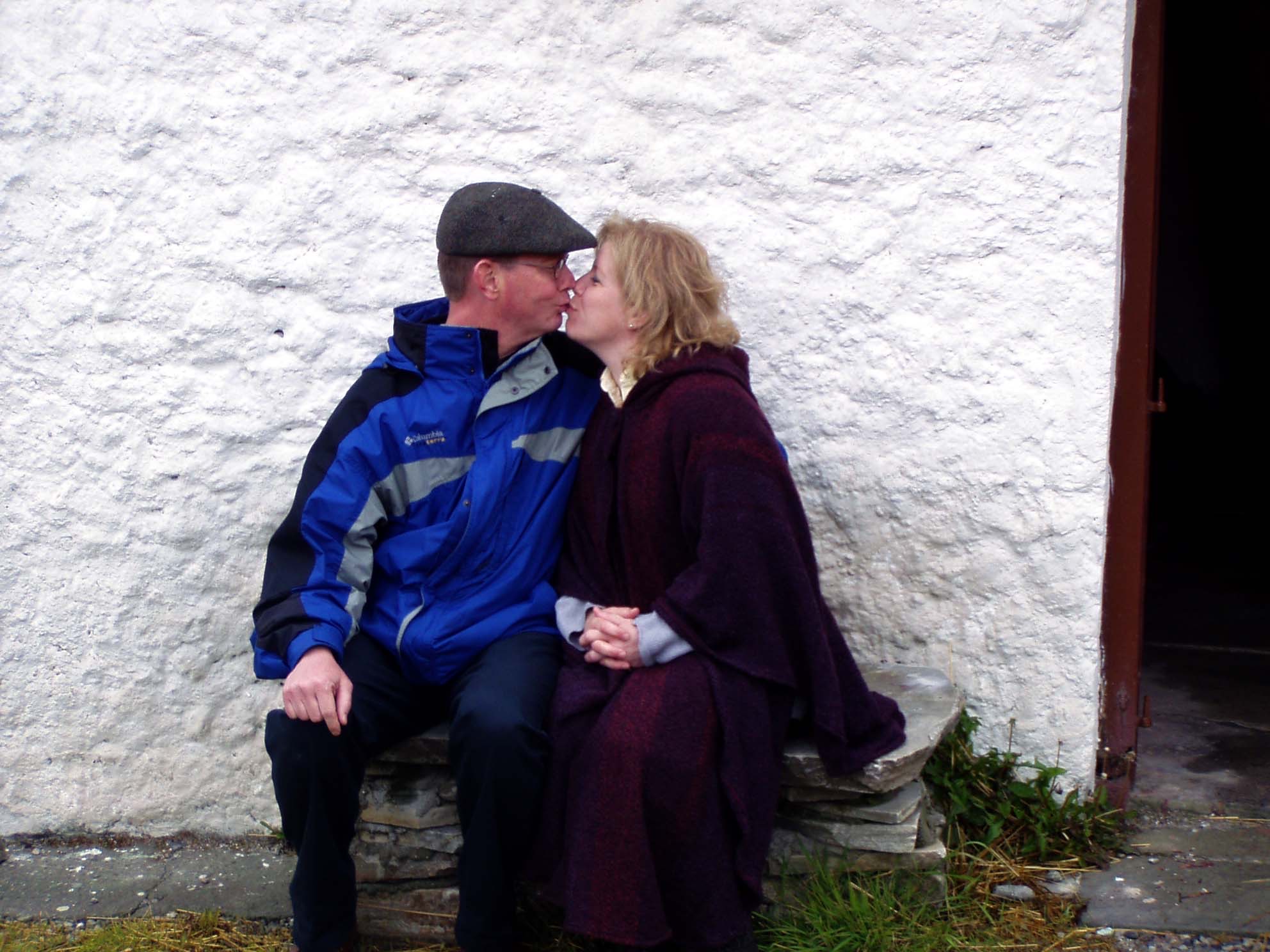 Brad and LuAnne Anderson share a kiss while sitting on a bench during a trip to Ireland in 2003.<br />(Courtesy of Brad Anderson)