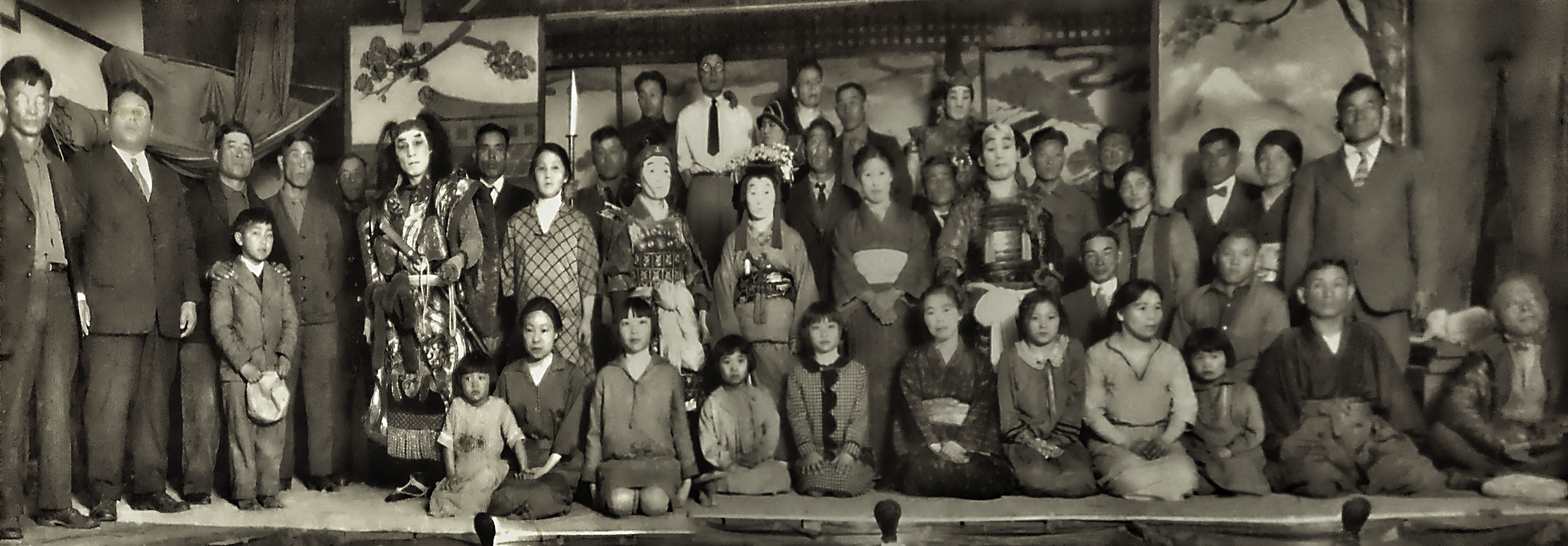 Japanese-American actors on stage at the Japanese Hall in Scottsbluff in the 1930s. Hundreds of Japanese immigrants landed in western and central Nebraska in the early 20th century, becoming farmers and business owners while starting families that now, several generations later, have scattered across the country but still call towns like Scottsbluff, Gering, Mitchell, and North Platte home.  (Courtesy of Vickie Sakurada Schaepler / Flatwater Free Press)