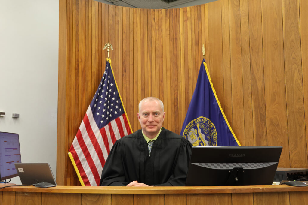 Judge Derek Weimer says he has grown accustomed to helping litigants representing themselves in court, which can be an intimidating experience. “It is sort of the equivalent of walking into an operating room and hoping that you can figure out which instrument to pick up.”<br />(Irene North / Flatwater Free Press)