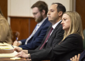 Attorneys Anne Mackin (right) and Andrew La Grone listen to testimony on the first day of the civil trial to determine the validity of the medical marijuana ballot measures at the Lancaster County Courthouse on Tuesday, Oct. 29, 2024, in Lincoln.<br /> (Kenneth Ferriera-Pool / Lincoln Journal Star)