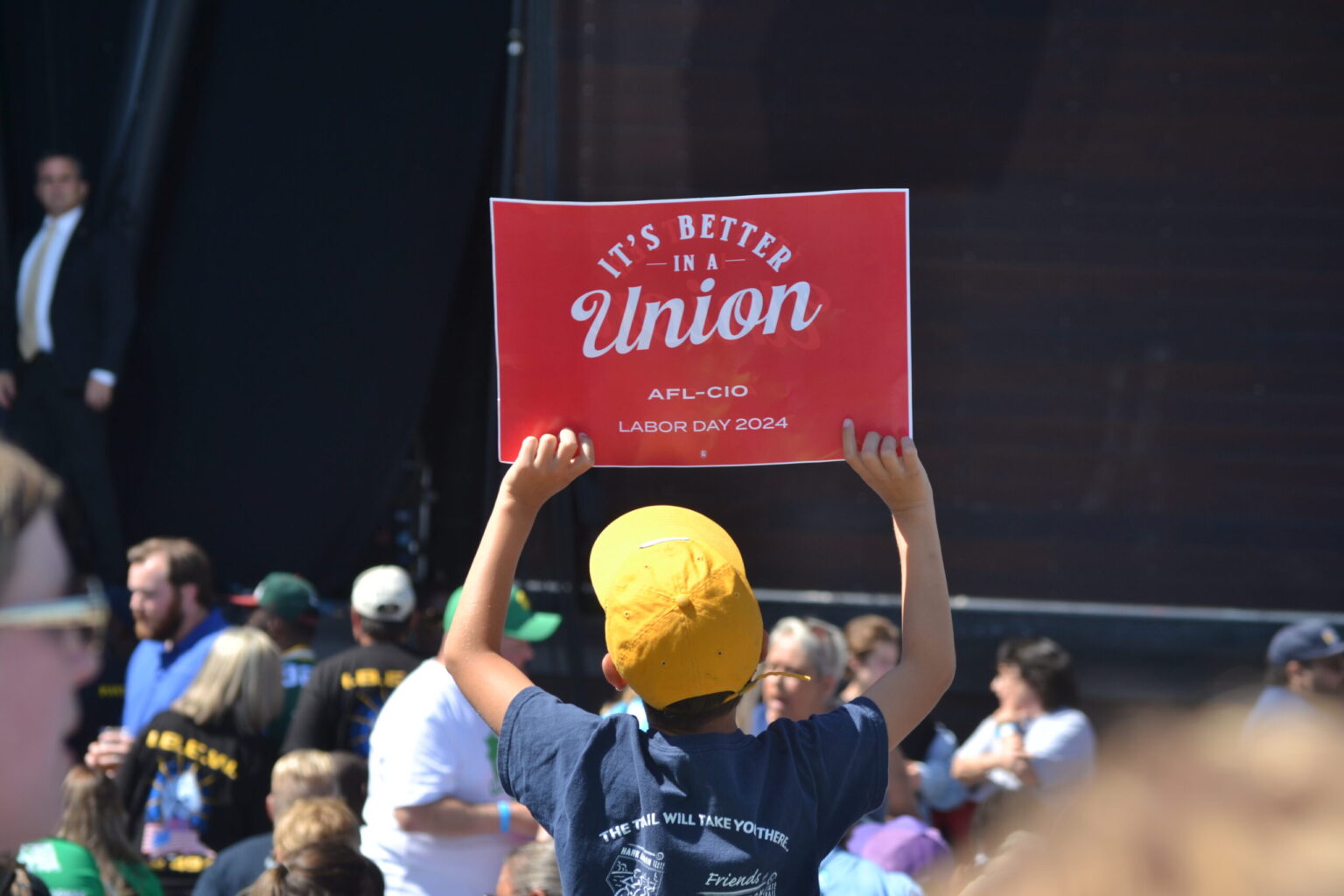 A youngster holds up a pro-union sign during a break between speeches on Labor Day at Laborfest in Milwaukee. Both presidential candidates are trying to appeal to union members.<br />(Erik Gunn / Wisconsin Examiner)