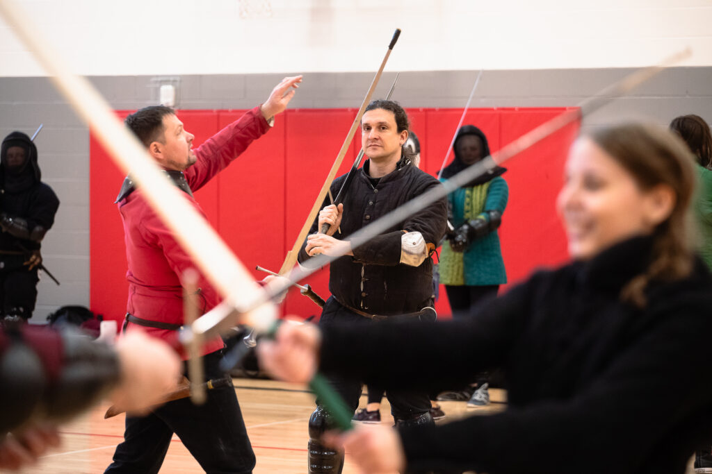 Head Instructor Joe Loder watches members of the Nebraska Swordfighters Guild as he and fellow instructor Daniel Cadenbach give a demonstration during the guild’s Fight Camp, held Saturday, Jan. 25, 2025. The guild holds regular practices on Monday evenings, and began holding day-long intensives – like Fight Camp – to provide more opportunities for new and advanced guild members to learn sword fighting skills.<br />(Liz McCue / Flatwater Free Press)