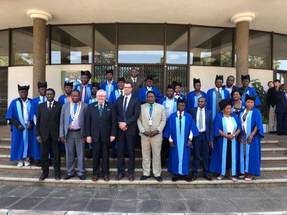Front row from left: Norfolk Schools in Malawi founder Joe Mtika, Mayor Wild Ndipo, then-Northeast Community College President Michael Chipps and Norfolk Mayor Josh Moenning pose with other officials at a 2018 ceremony celebrating Norfolk and Blantyre, Malawi, becoming sister cities. Supporters say the school and nonprofit has helped dozens of Malawian teenagers get a U.S. college education and better their lives.<br />(Courtesy photo)