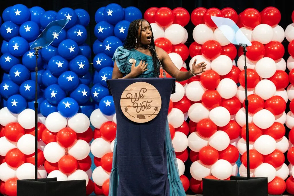 Jayde Dorsey sings “Lift Every Voice and Sing” at the Nebraska Democratic Party’s Ben Nelson Gala in Omaha on Oct. 5, 2024. Her standing-ovation performance made an impression on several notable figures in attendance.<br />(Photo courtesy of BCom Solutions)