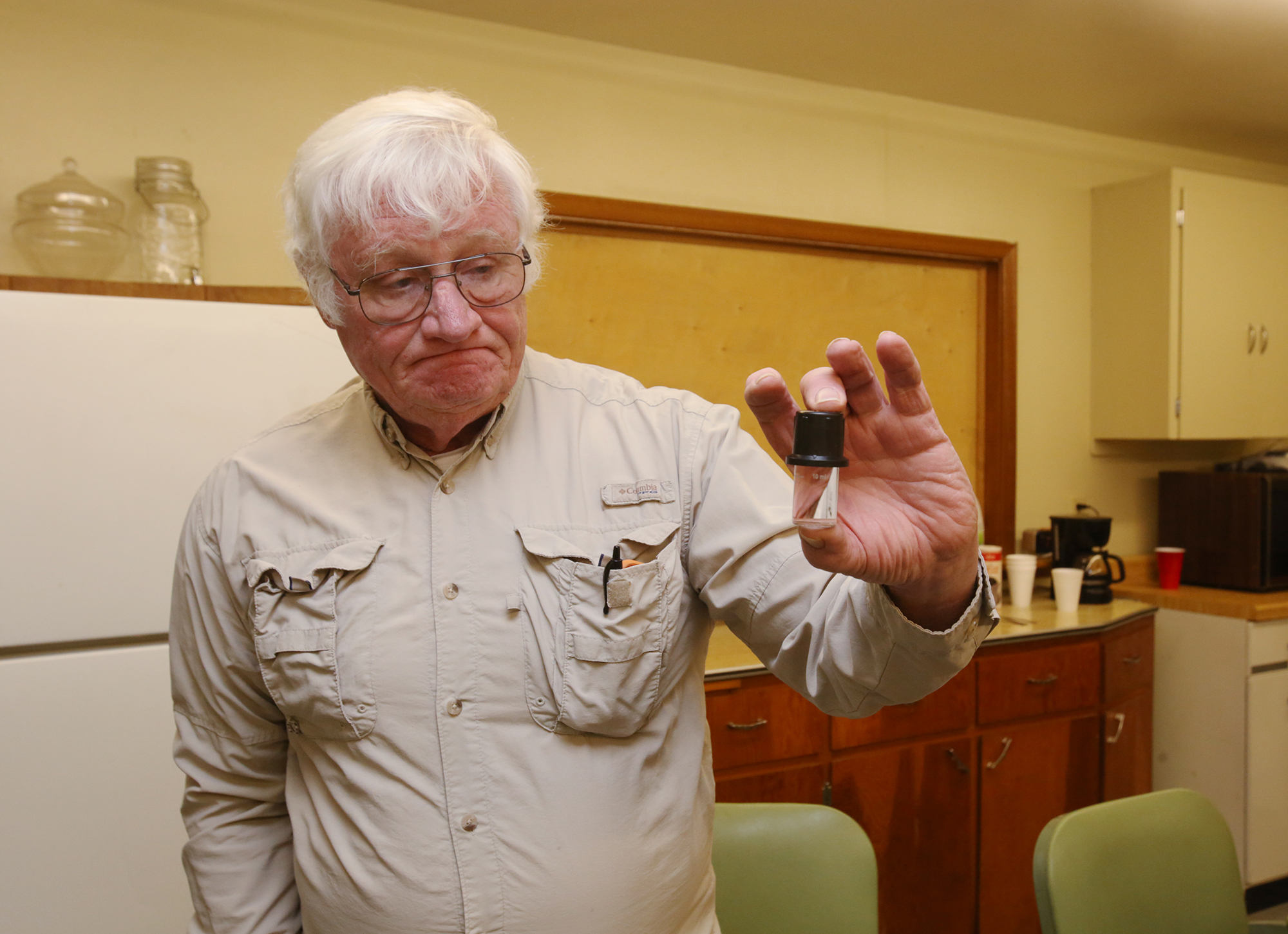 Mike Matthews holds a vial he uses when testing for nitrate in water on December 1. Each test costs $16. There are 37 reverse osmosis, or RO, systems to test in town. Prosser is one of many towns grappling with the costs of trying to remove nitrate from their water supply – roughly 10 percent of Nebraska communities have tested nitrate levels higher than the federal standard at least once since 2010. (&lt;a href=&quot;<a href="https://flatwaterfreepress.org/author/acostello/&quot;&gt;Laura">https://flatwaterfreepress.org/author/acostello/&quot;&gt;Laura</a> Beahm&lt;/a&gt; / Flatwater Free Press)