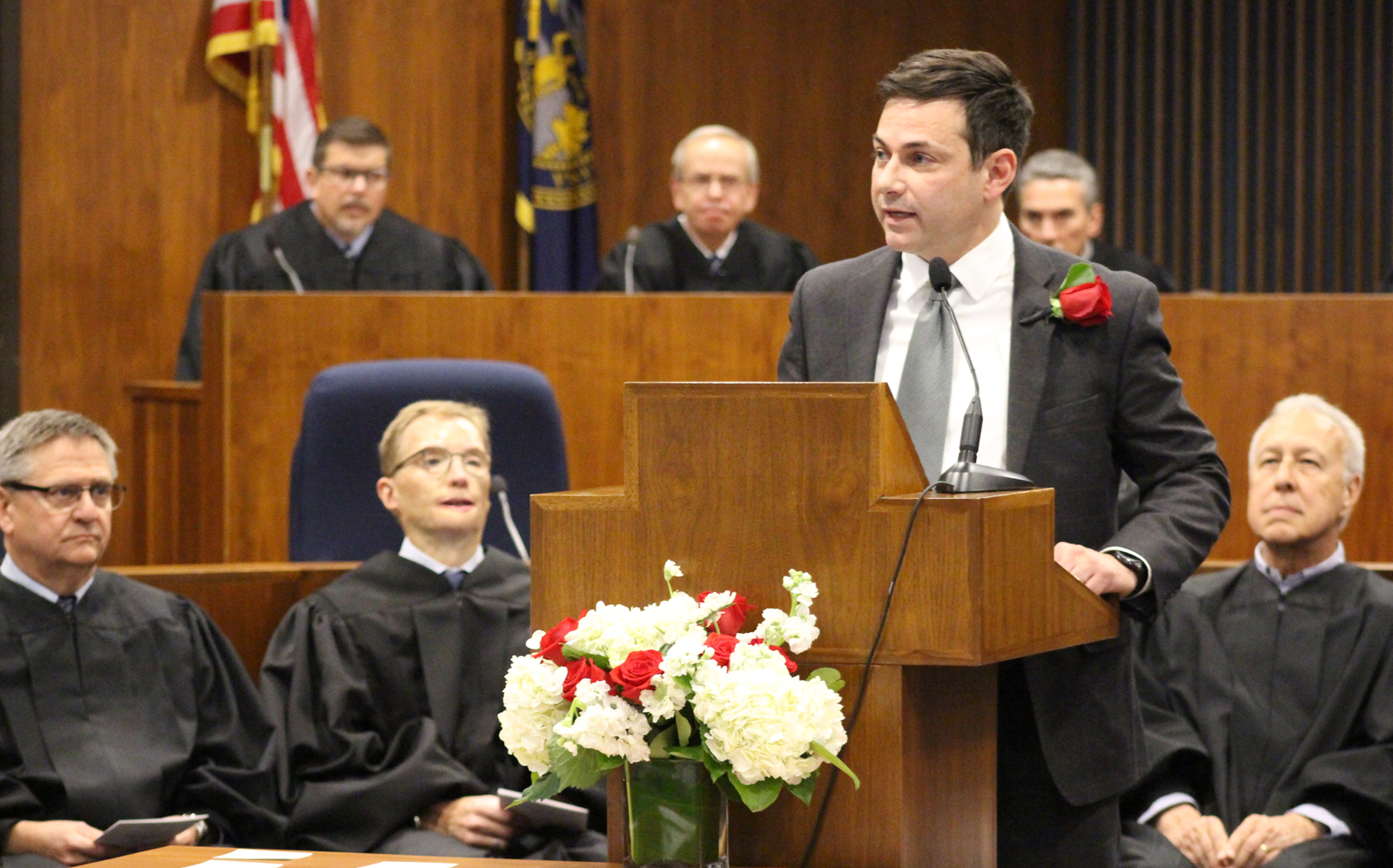 Stacy L. Morris of Lamson Dugan &amp; Murray, chair of the Omaha Bar Association Memorial Committee, gives the call to order at the OBA’s annual Memorial Day Program in the legislative chamber of the Omaha-Douglas Civic Center on May 10, 2019. (Photo by Scott Stewart)