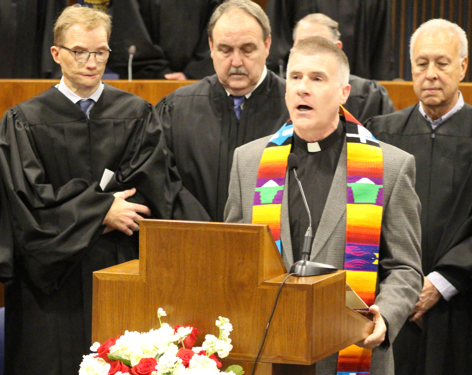 The Rev. Lorn J. Snow, pastor at St. John’s Parish at Creighton University, delivers the invocation during the Omaha Bar Association’s annual Memorial Day Program in the legislative chamber of the Omaha-Douglas Civic Center on May 10, 2019. (Photo by Scott Stewart)