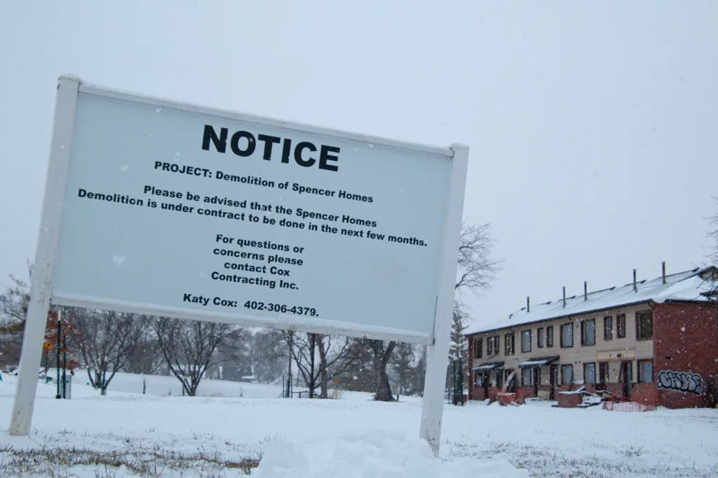 A sign recently installed in front of Spencer Homes East says the abandoned public housing apartments will be demolished. The North Omaha buildings have stood vacant since summer 2022.<br />(Jeremy Turley / Flatwater Free Press)