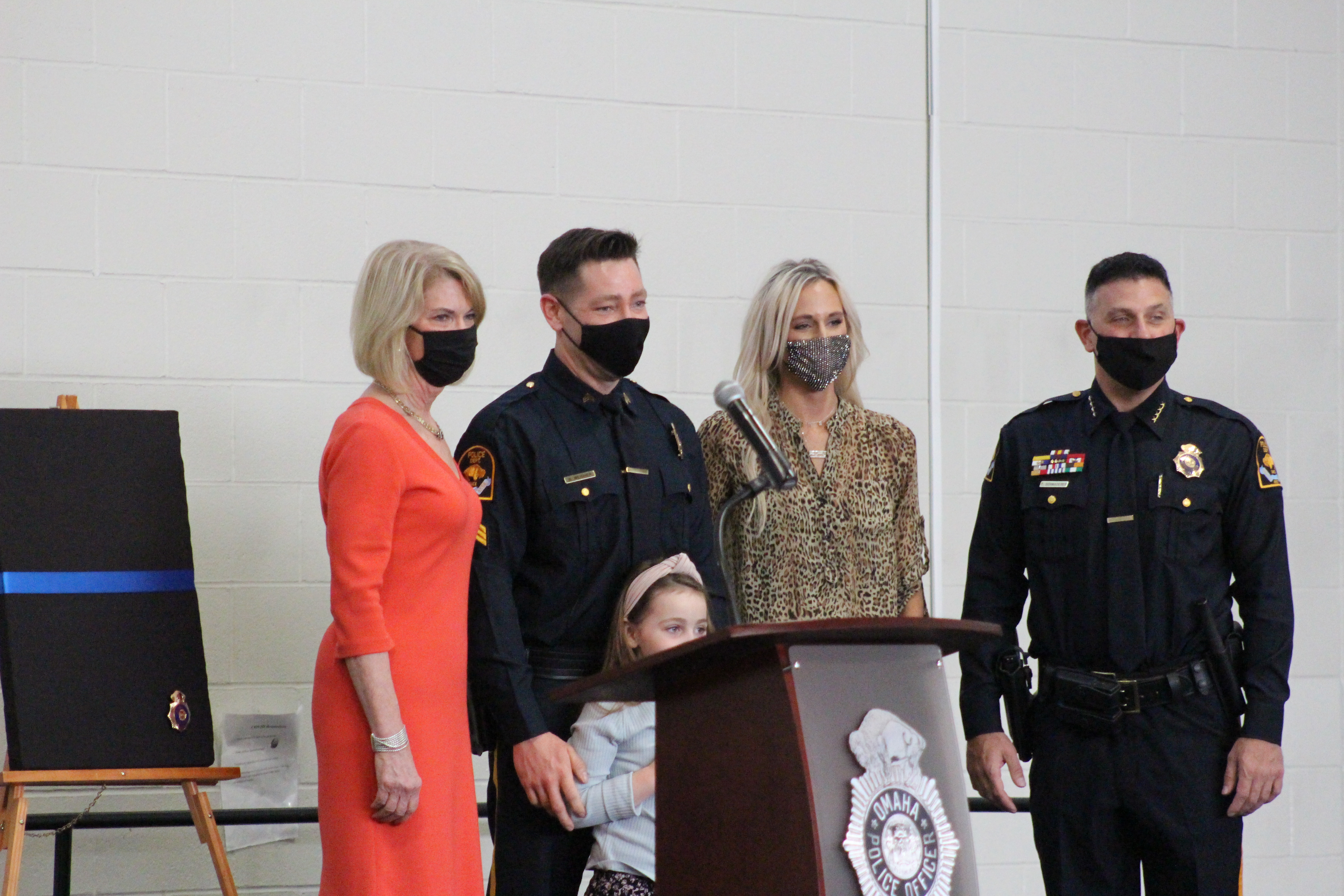 Benjamin Weidner, second from left, poses for a photo after being promoted to sergeant at an Omaha Police Department promotion ceremony Friday, March 19, 2021l at the Omaha Public Safety Training Center in Omaha. Weidner is joined with his family, along with Omaha Mayor Jean Stothert, far left, and Omaha Police Chief Todd Schmaderer, far right. (Derek Noehren/Daily Record)