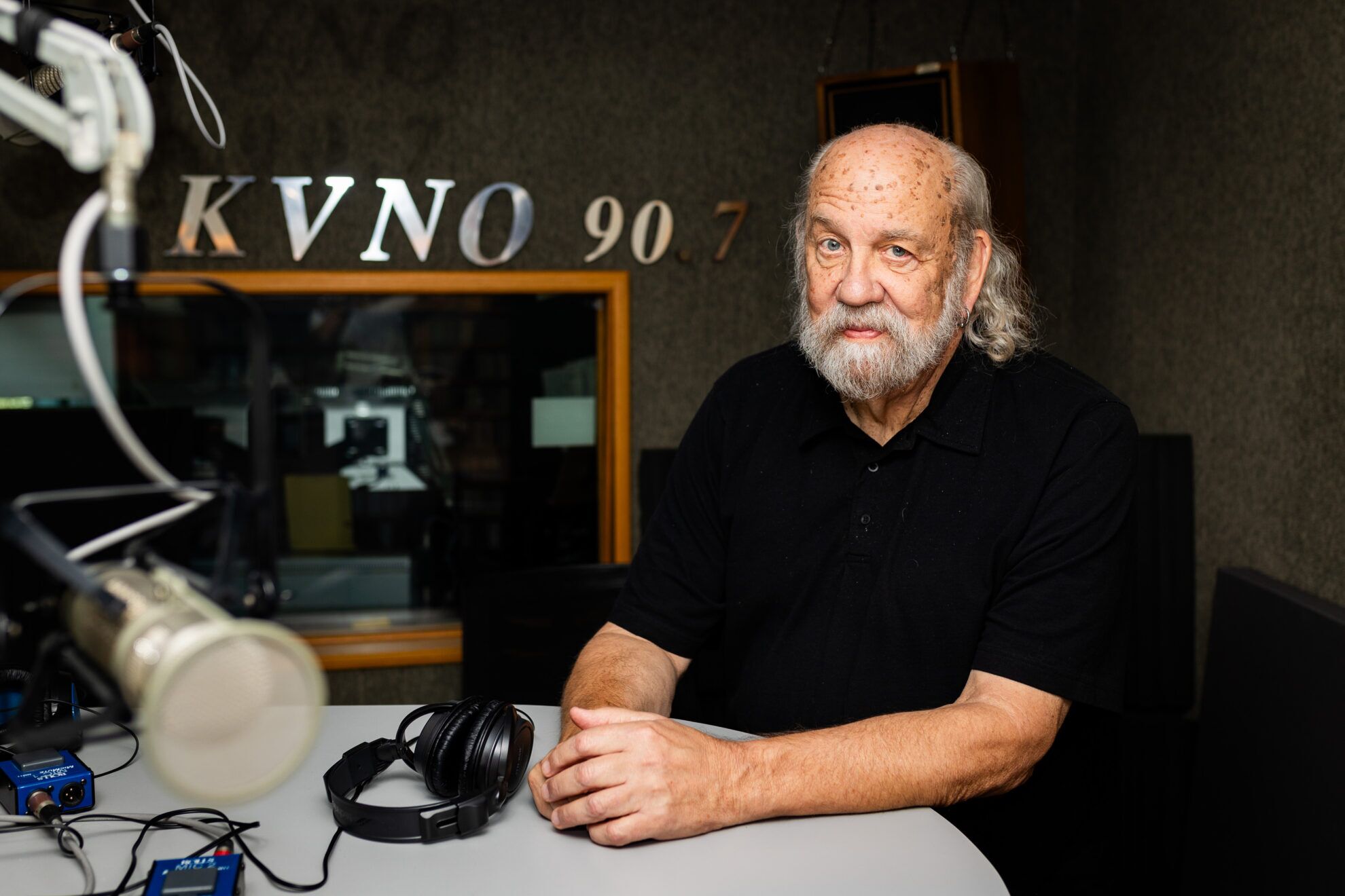 Radio personality Otis Twelve, real name Douglas Wesselmann, signed off from Omaha’s classical music station KVNO for the final time Oct. 4, 2024. He spent 18 years at the station, which seemed an unusual fit at first. His background was in rock and talk radio.<br />(Joseph Saaid / Flatwater Free Press)