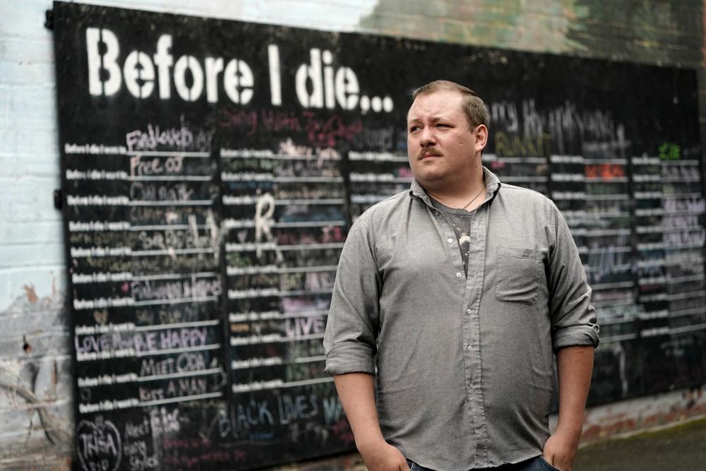 Nate Mullins, a former bartender from Oak, Harbor, Wash., who quit his job last November after clashing with managers over enforcing mask rules, poses for a photo near a street mural Monday, May 17, 2021, in Mount Vernon, Wash. There’s a wild card in the push to return to post-pandemic life: many workers don’t want to return to the jobs they once had. (AP)