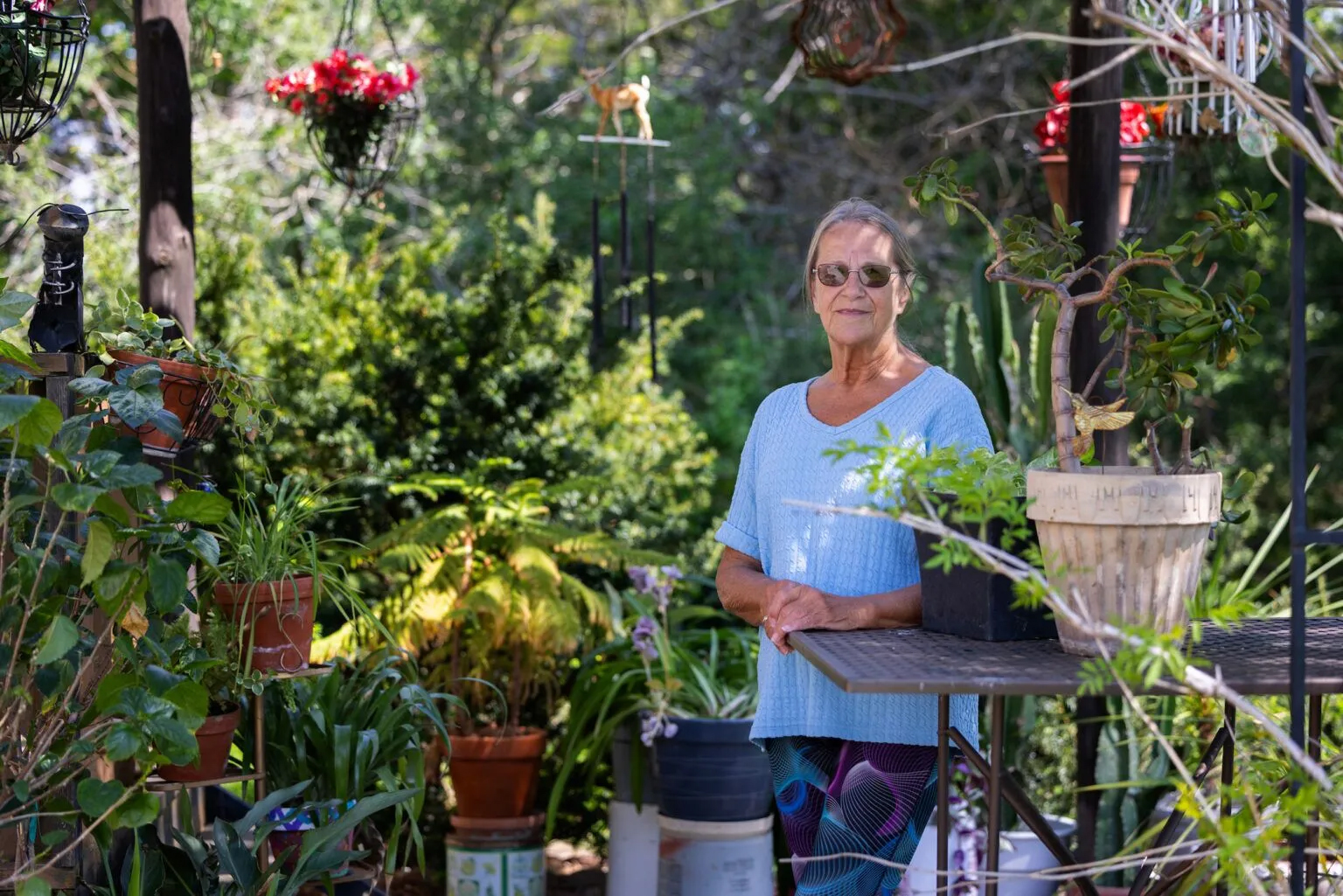 Dorian Kaspar lives across the road from Pillen Family Farms’ Northern Plains site near St. Edward. Kaspar said the hog farm’s odor has interfered with her passion for gardening, tending flowers and being outside.<br />(Rebecca S. Gratz / Flatwater Free Press)