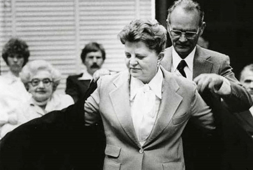 Mary Lou Robinson, dons her robe at her investiture in the Northern District of Texas, died in January 2019. In an oral history, she said women were forbidden to serve on Texas juries when she first served on the state bench. (Courtesy Northern District of Texas via U.S. Courts)