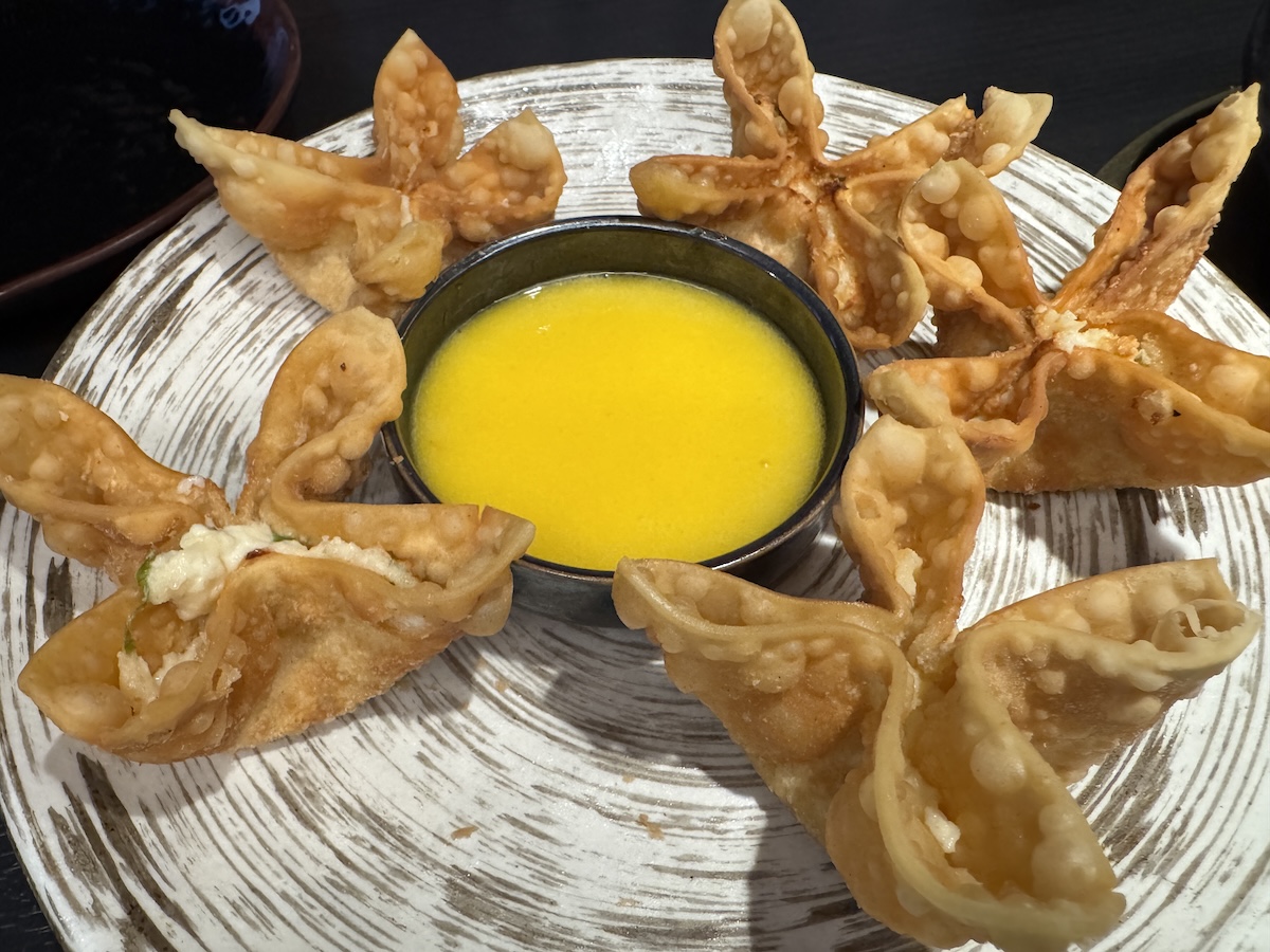 Lobster and crab rangoon, part of the Koen Premium sampler, come served with a mango dipping sauce.<br />(Sarah Baker Hansen / Flatwater Free Press)