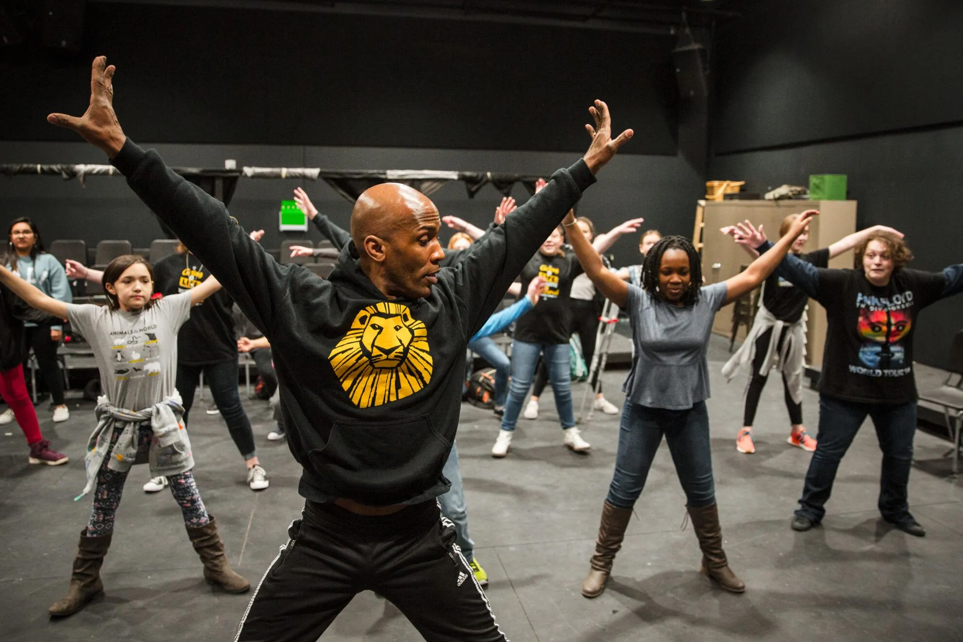 Dancer-choreographer Ray Mercer shows students the moves during a Nebraska High School Theatre Academy masterclass in February 2019. Mercer, an Omaha native, danced in the Broadway production of “The Lion King.”<br />(Photo courtesy of Omaha Performing Arts)