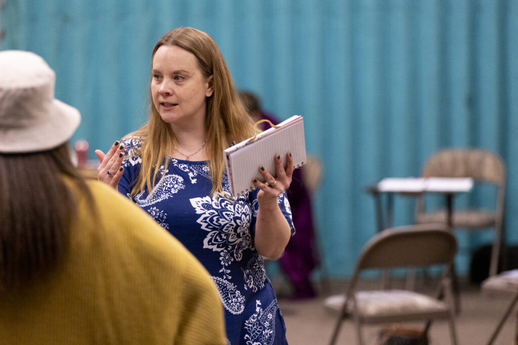 Haley Haas, the director of “By a Thread,” works with the cast during a rehearsal at St. Paul United Methodist Church in Omaha on Tuesday, March 18, 2025.<br />(Anna Reed / Flatwater Free Press)