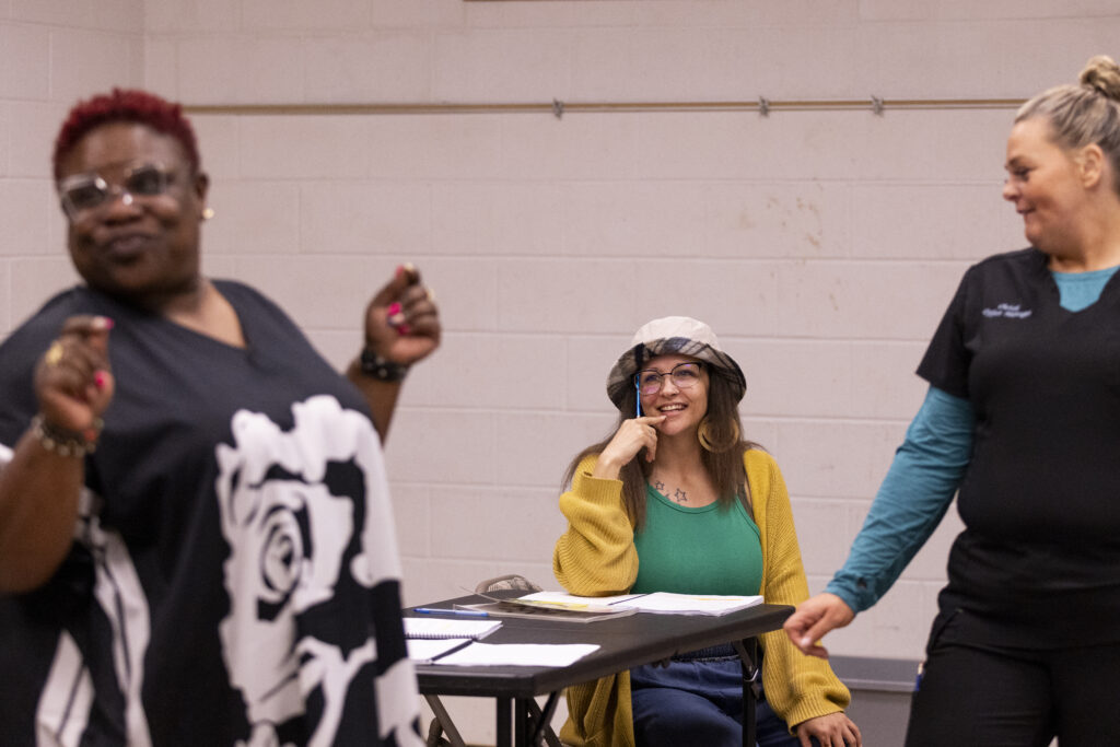 Nature Medicine Song Villegas (center) works through a scene with castmates Demetrius Gatson (left) and Christy Farlee during a rehearsal for “By a Thread,” a play put on  Tuesday, March 18, 2025.<br />(Anna Reed / Flatwater Free Press)