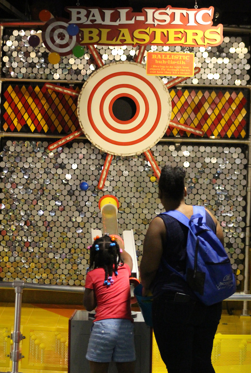 A child shoots a ball on the Ball-istic Blasters game at the Omaha Children’s Museum during the 10th annual Summer Family Reunification Picnic on June 7, 2019. (Photo by Scott Stewart)