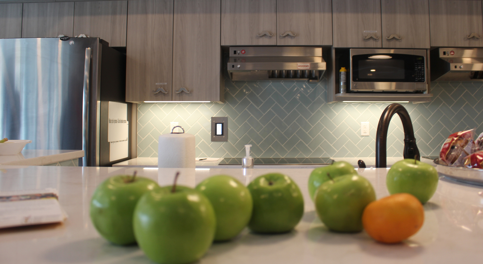 A new kitchen in the Ronald McDonald House features mustache-shaped cabinet handles, which recognize donations made through Mustaches 4 Kids Omaha. The nonprofit is supporting Angles Among Us this year. (Photo by Scott Stewart)