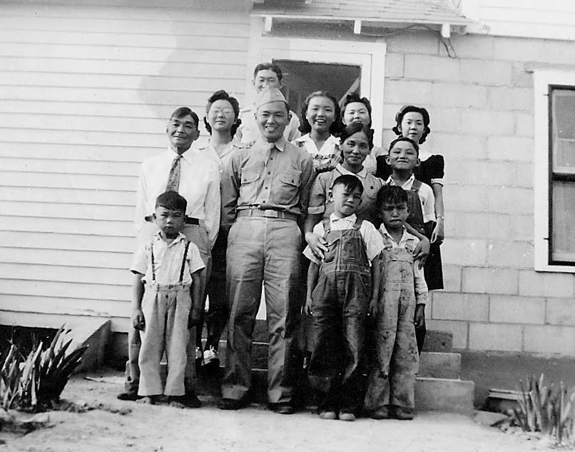 Shizuo Sakurada, father of Vickie Schaepler of Kearney, was surrounded by family while home on leave. He enlisted in the U.S. Army after the Dec. 7, 1941, attack on Pearl Harbor. His living siblings are Hisaya of Gering (middle back), Fred of Morrill (lower left) and Nick (second row, far right).<br />(Photo courtesy of Vickie Schaepler)