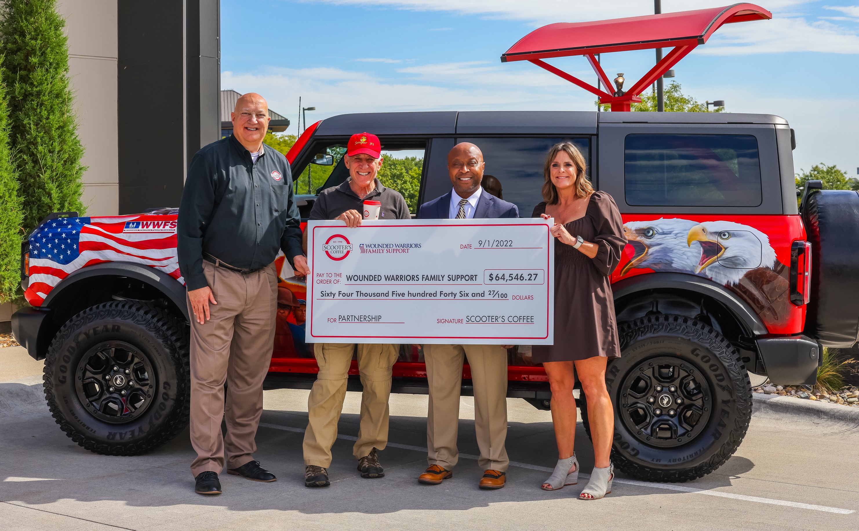 Pictured from left to right: Bill Black, Scooter’s Coffee Chief Marketing Officer; Colonel John D. Folsom, Wounded Warriors Family Support Founder and President Emeritus; Joe Thornton, Scooter’s Coffee President; Kate McCauley, Wounded Warriors Family Support CEO and President. (Courtesy of Scooter’s Coffee)