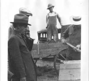 Author/poet John Neihardt supervises the final construction of a concrete monument erected in 1923 to commemorate the heroics of mountain man Hugh Glass, who crawled miles after being left for dead after a grizzly bear mauling.<br />(Courtesy of Joseph Weixelman and University of Missouri)