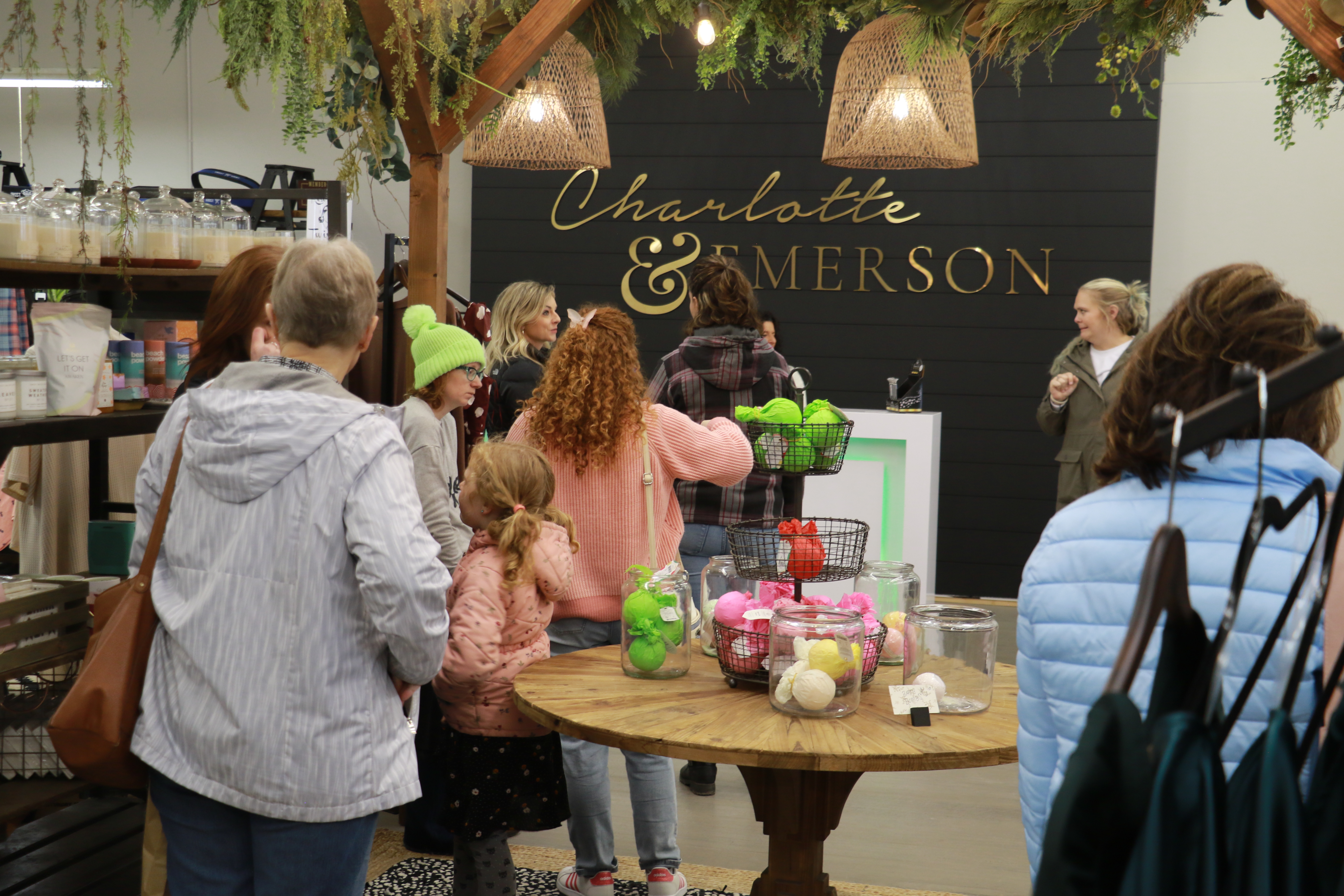 Charlotte &amp; Emerson in downtown Sidney bustles with customers on a Saturday in March. The boutique, a magnet for Nebraska teens searching for the perfect prom dress, is co-run by Sarah Kaiser, a former Cabela’s employee who founded the boutique with her sister. Sidney has fared better than expected since Cabela’s left in 2017 in part because former employees stayed and opened small businesses, experts say. (Fletcher Halfaker / Flatwater Free Press)