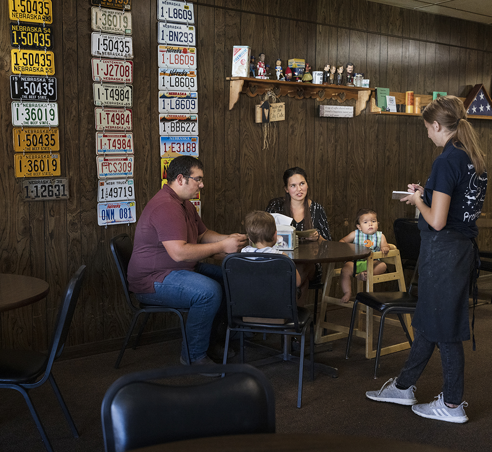 From left, Sam Torres, his son, Sammy, 3, his wife Nicole Torres, and his son, Jeremiah, 1, order lunch from waitress Morgann Johnson at the City Cafe, Saturday, Aug. 28, 2021. (Ryan Soderlin / Flatwater Free Press)