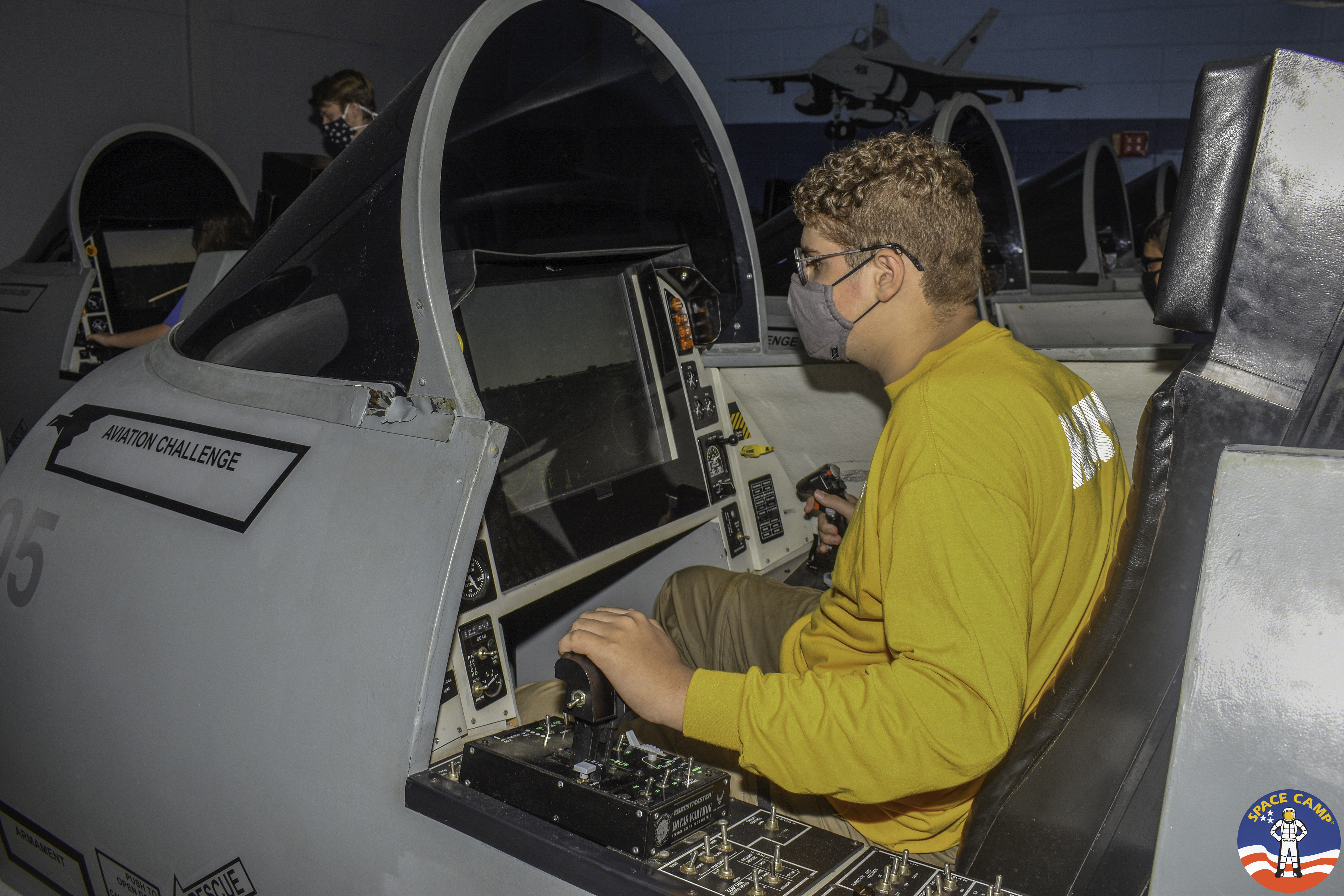 Brenden Cunningham sits in a flight simulator at the U.S. Space &amp; Rocket Center in Huntsville, Ala. (Space Camp via Amy Cunningham via RPS)