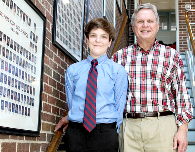 Peter Sullivan and his eighth-grade teacher Greg Gorski take time at St. Pius/St. Leo School to savor his third-place award in the Law Day Essay Contest. This is the third year that students of Gorski have won awards in the contest. (Photo by Lorraine Boyd)