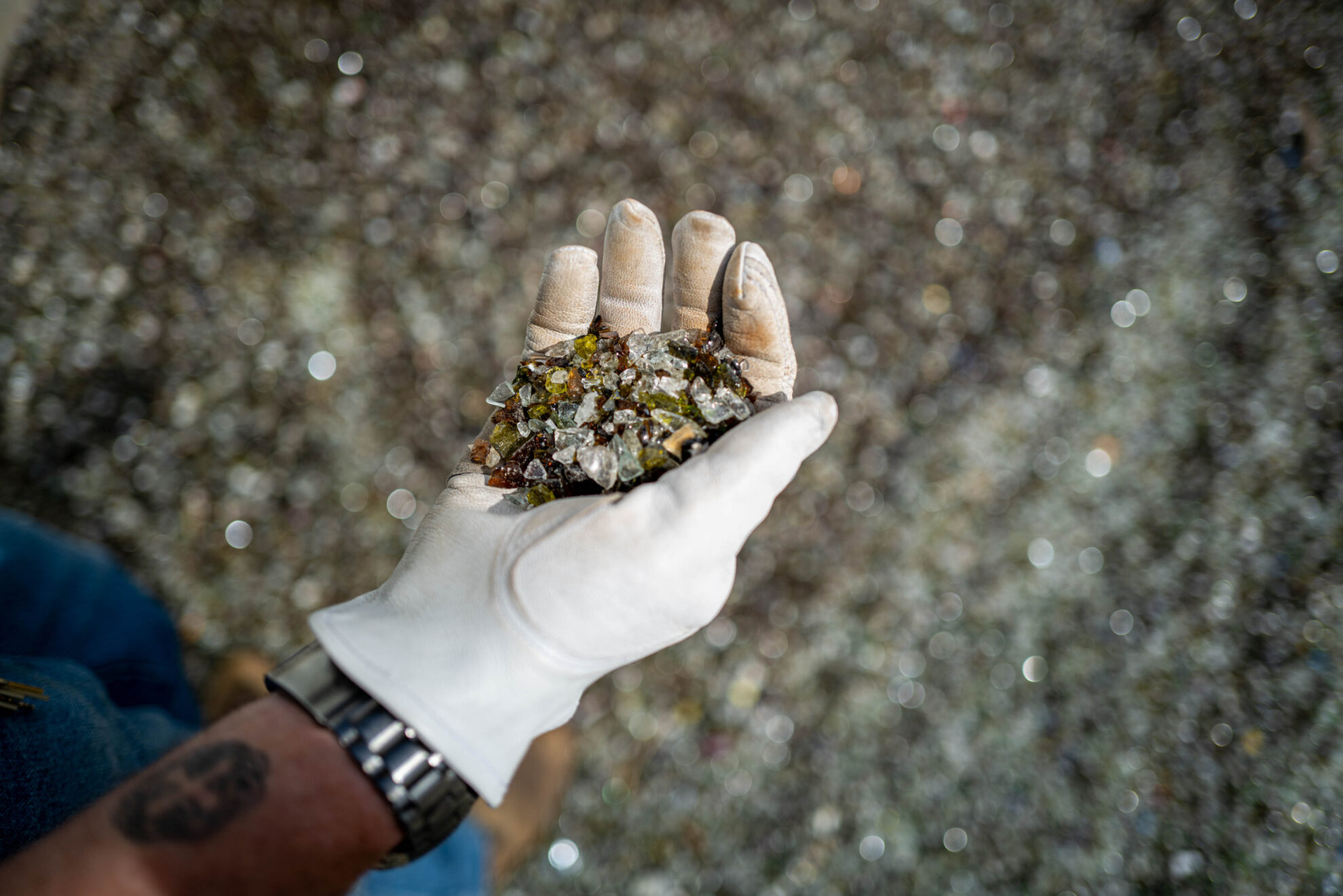 The glass, ground up in a sand-like texture, can be mixed with asphalt and concrete for road construction, according to Nathan Lund with the city.<br />(Abiola Kosoko / Flatwater Free Press)