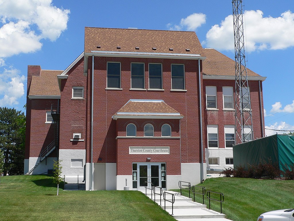 Thurston County Courthouse in Pender, Nebraska; seen from the west. A lawsuit filed last Thursday in U.S. District Court maintains that county supervisor districts were intentionally redrawn to dilute the vote of Native Americans, in violation of the federal Voting Rights Act.<br />(Wikimedia Commons)