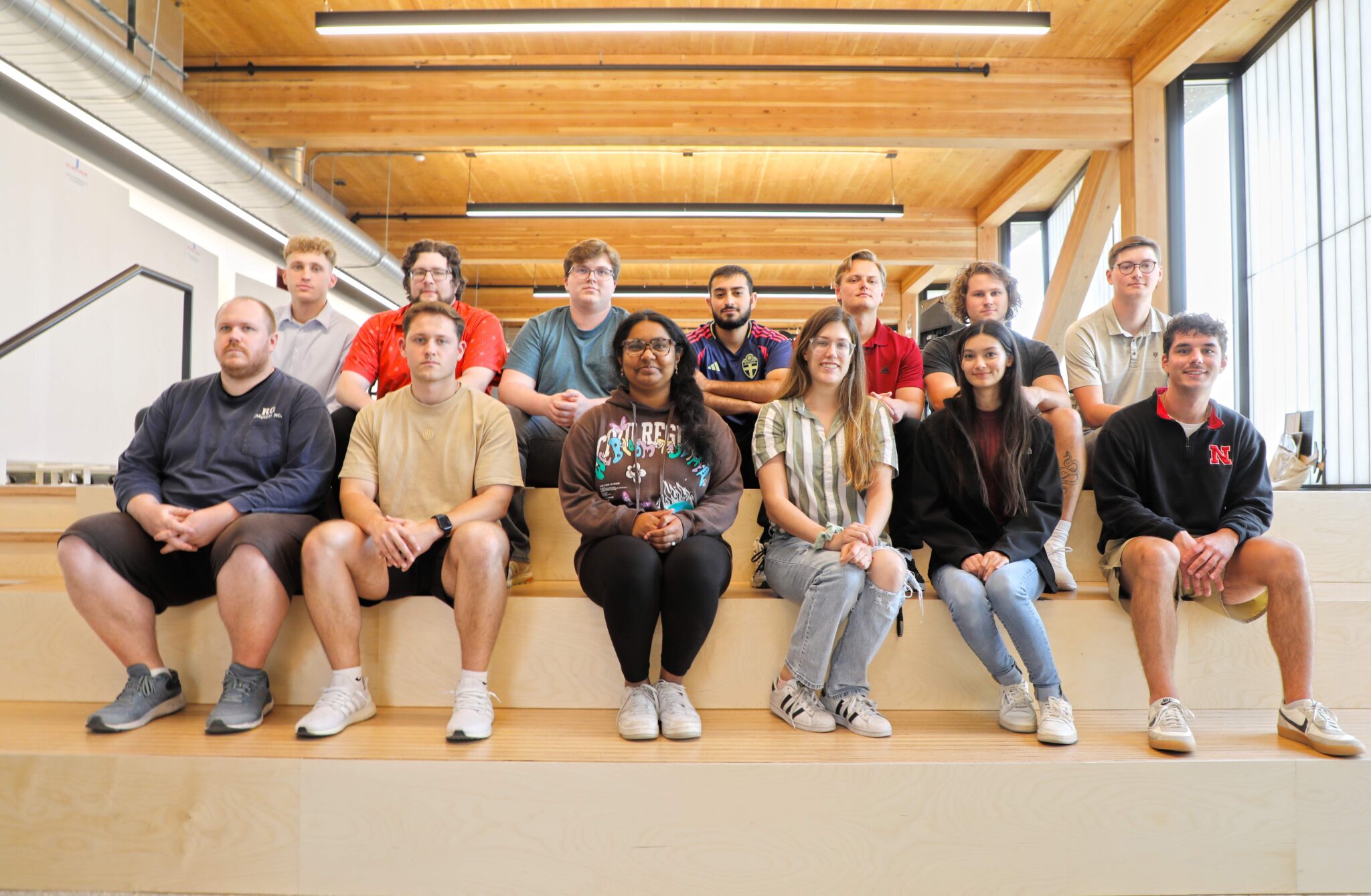 Members of Fabrication And Construction Team (FACT) at UNL College of Architecture. Bottom row (left to right) Carl Williams, Nico Forte, Sreemedha Chintamadaka, Machelle Cooper, Paulina Garcia, Luke Heidenreich. Top row (left to right) Riley Jarosz, Michael Rieder, Oz Eckhorn, Malik Darwish, Alex Martino, Trent Weatherwax, Gavin Stelling.<br />(Courtesy of FACT)