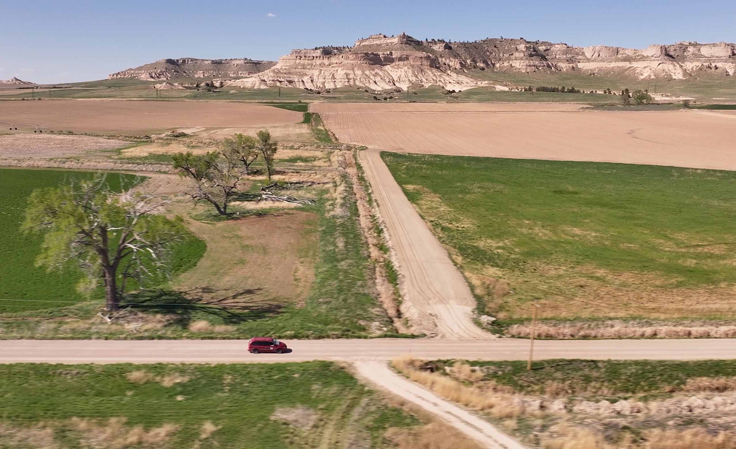 Rural letter carrier Roger McDonald prefers to drive a Dodge Caravan on his rural route, located in Scotts Bluff County, Neb. The area is known for its beautiful rugged bluffs and some native prairie grasses.<br />(Nick Loomis / The Midwest Newsroom)