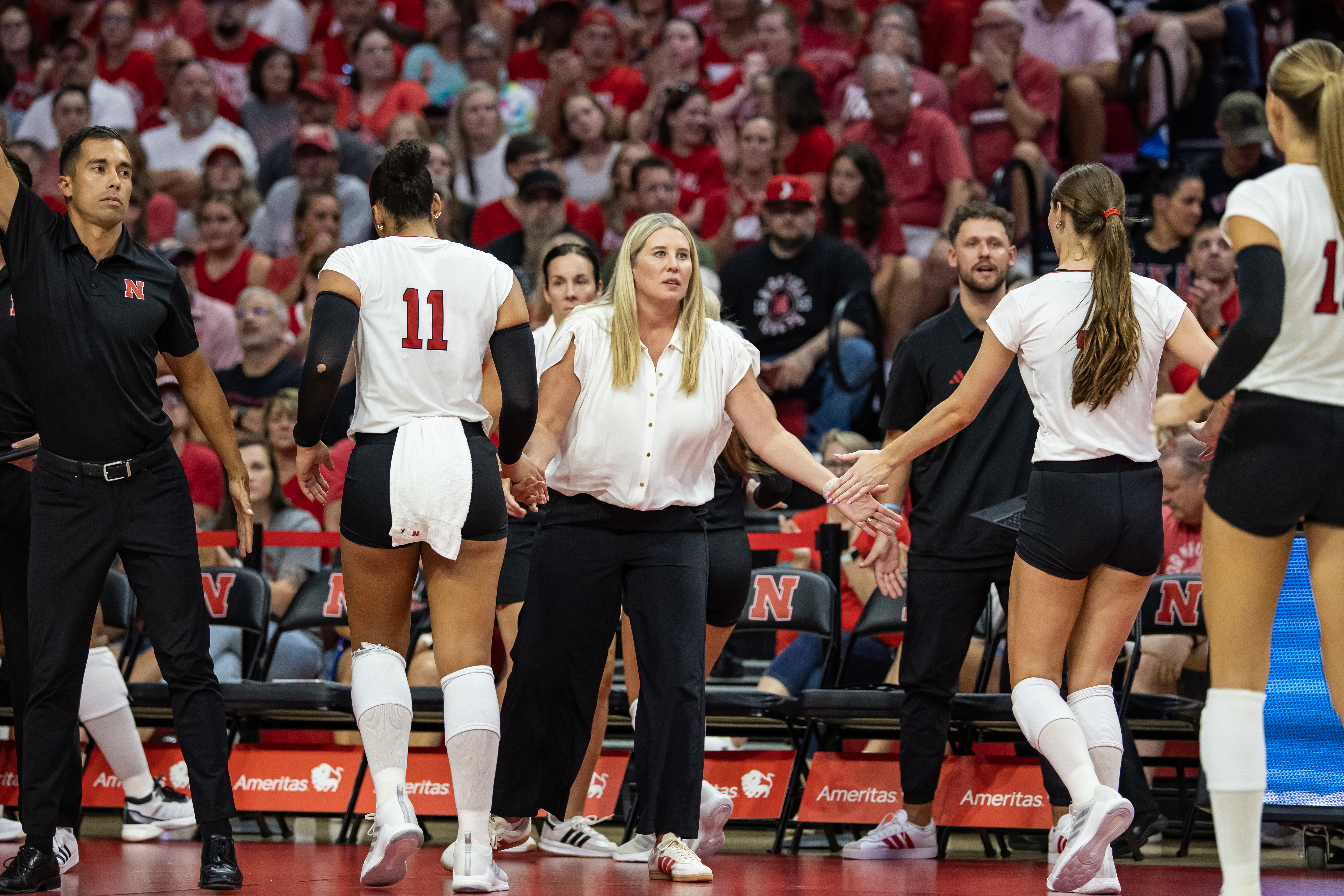 Husker head coach Dani Busboom Kelly greets players during a break in the exhibition match against a team made up of Nebraska alumni in the Devaney Center on Aug. 16. Nebraska starts its 2025 season Aug. 22 against the University of Pittsburgh.<br />(Courtesy of Nebraska Athletics)