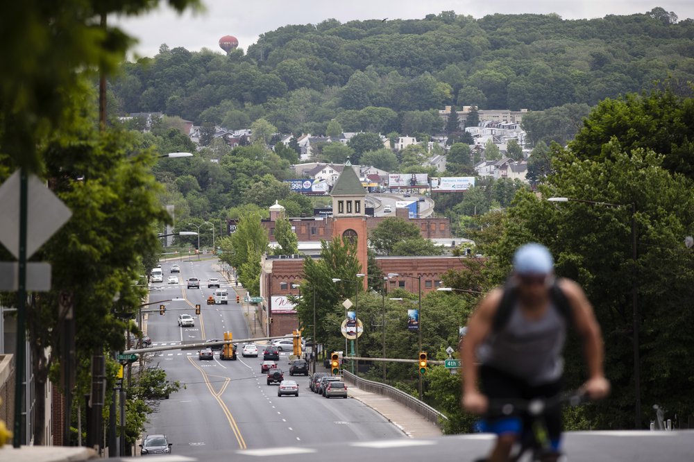 A cyclist pedals up a hill in Allentown, Pa., Friday, May 29, 2020. Allentown predicts a budget deficit of over $10 million, a number officials say could go higher if the economy doesn’t rebound quickly. (AP)
