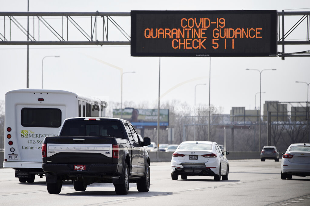 A road sign over Interstate 80 in Omaha directs motorists to contact 511 for quarantine guidance, March 31, 2020. Travelers coming back to Nebraska from out of state are asked to self-quarantine. (AP)