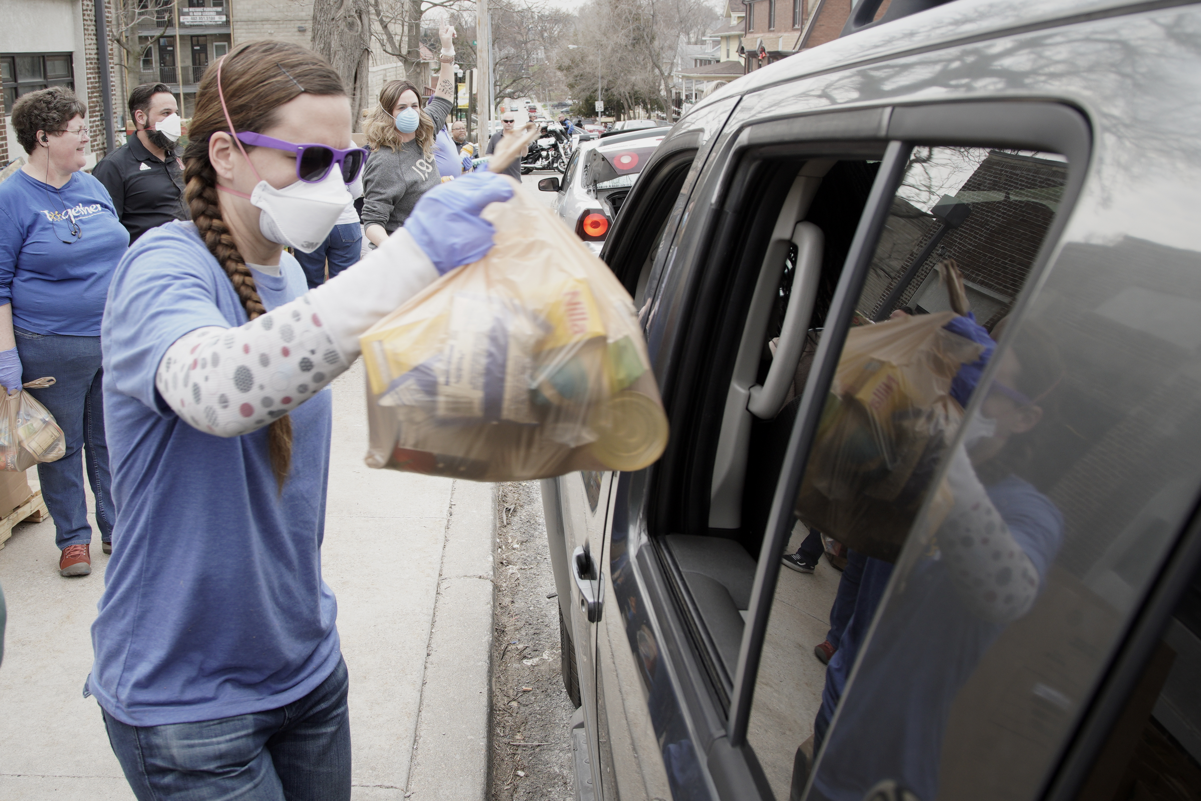 Together Inc. food bank workers distribute food at a drive-through location in Omaha on Tuesday, March 31, 2020. Donate to support Together’s efforts at squareup.com/store/together-inc. (AP)