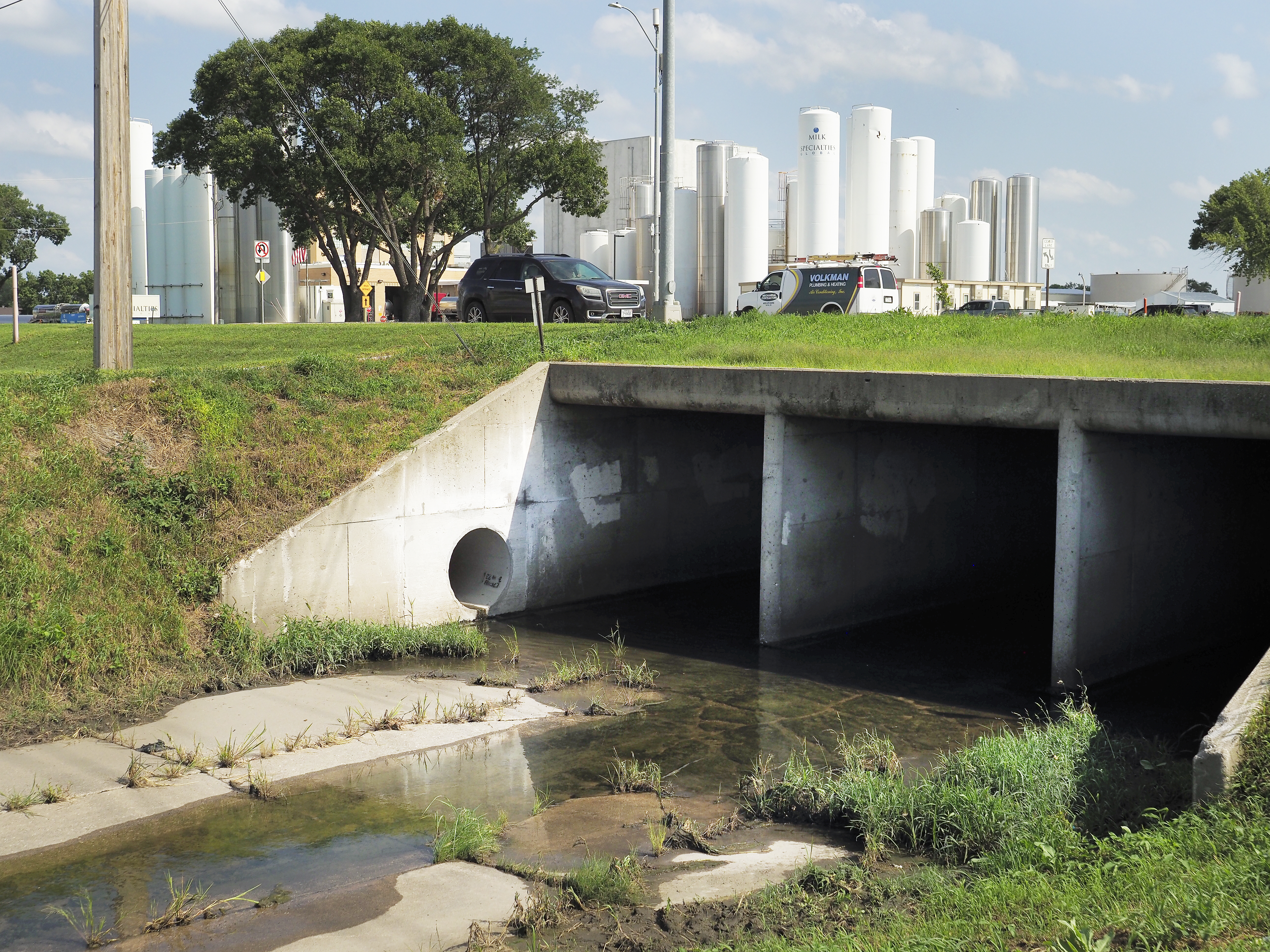 A water discharge ditch runs alongside Actus Nutrition in Norfolk, Neb. Wastewater violations by the plant have caused sour smells and other issues in the immediate area, drawing the ire of residents and nearby businesses.<br />(Jerry L Mennenga / Flatwater Free Press)