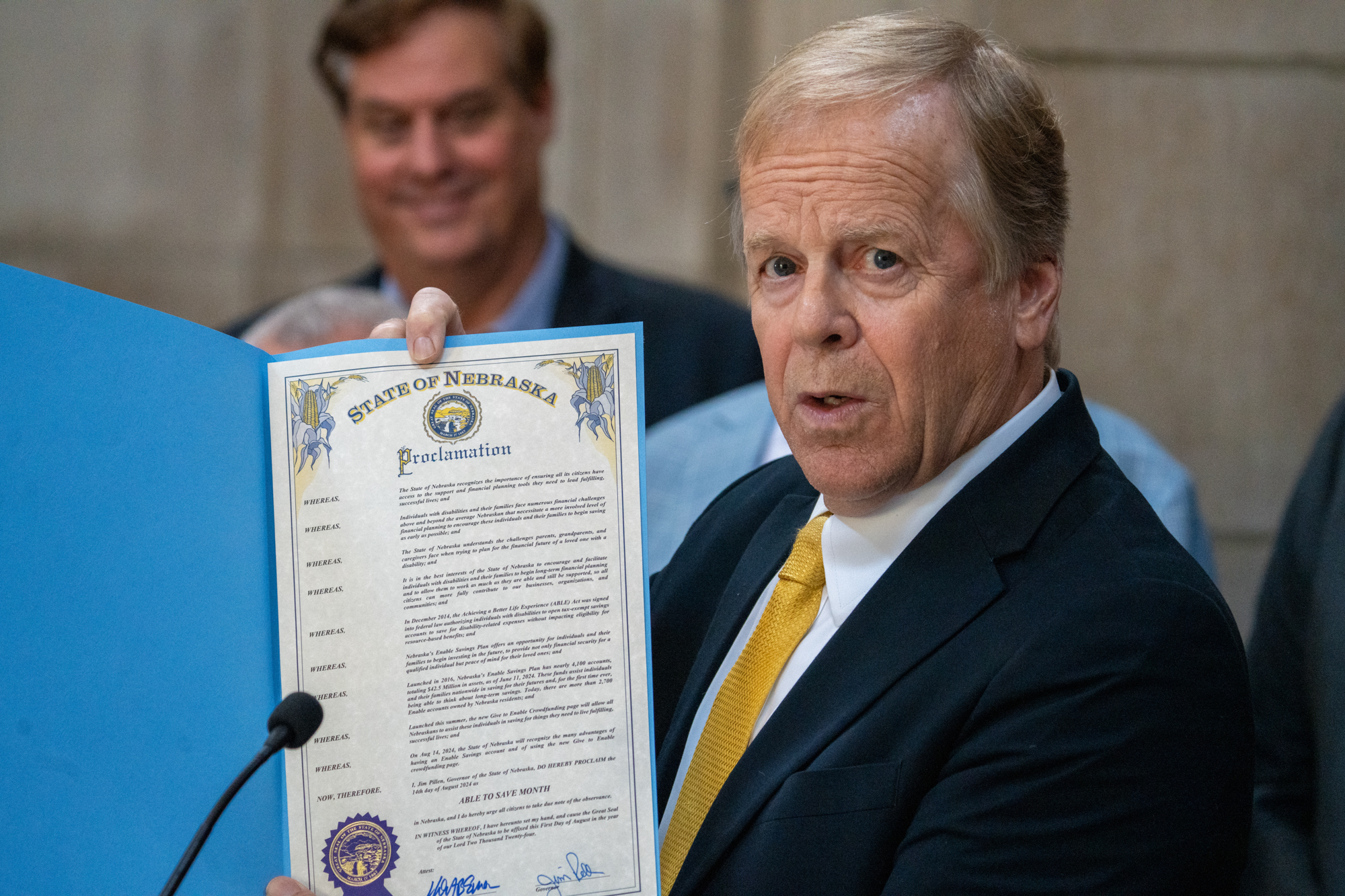 State Treasurer Tom Briese hosts a news conference on the Enable Savings Plan that assists people with disabilities live a fuller life. He holds a proclamation from Gov. Jim Pillen declaring August 2024 as “Able to Save Month,” Aug. 14, 2024.<br />(Zach Wendling / Nebraska Examiner)