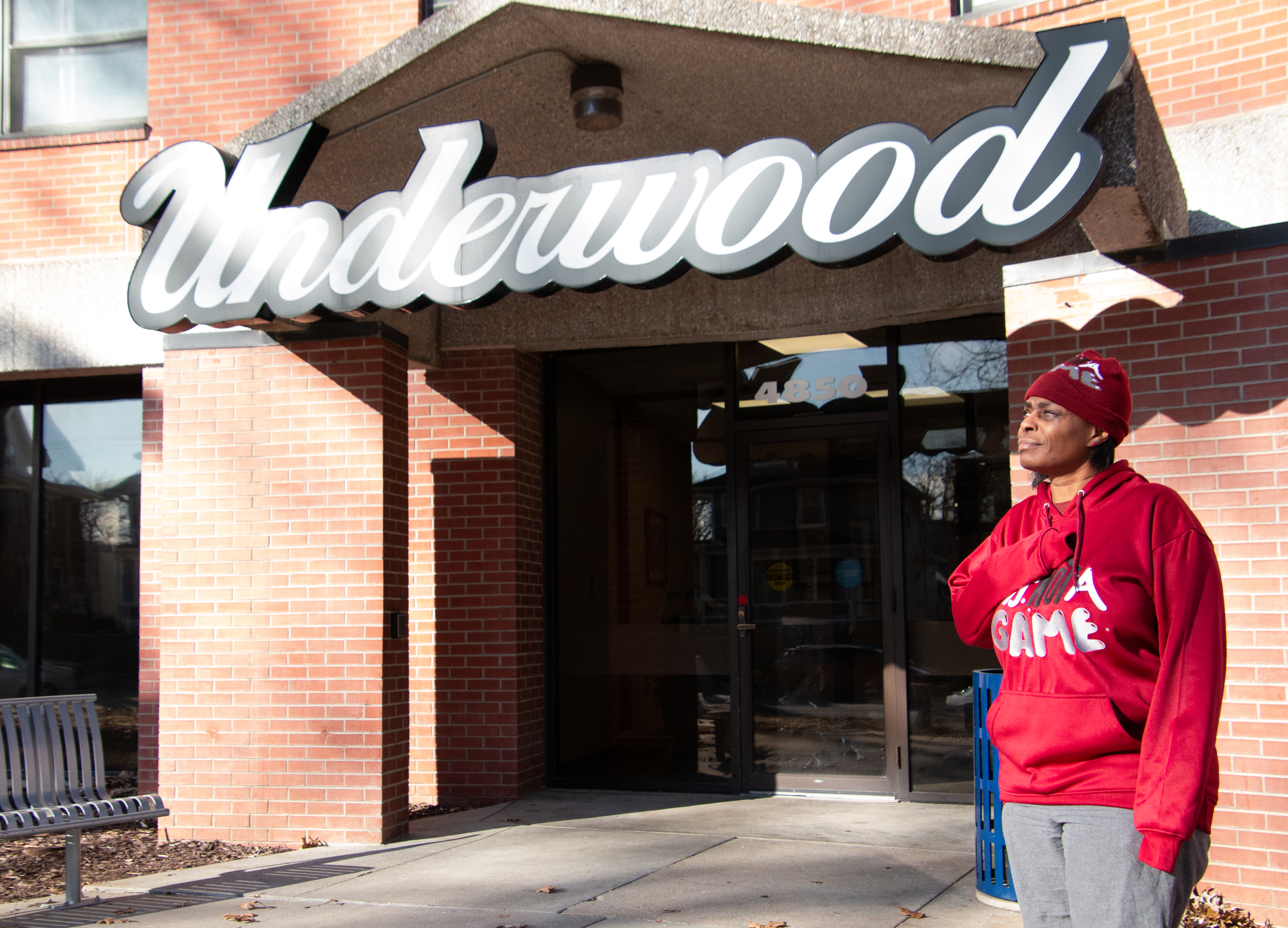 Denece Chappell stands outside of central Omaha’s Underwood Tower where her brother was found dead in June.<br />(Jeremy Turley / Flatwater Free Press)